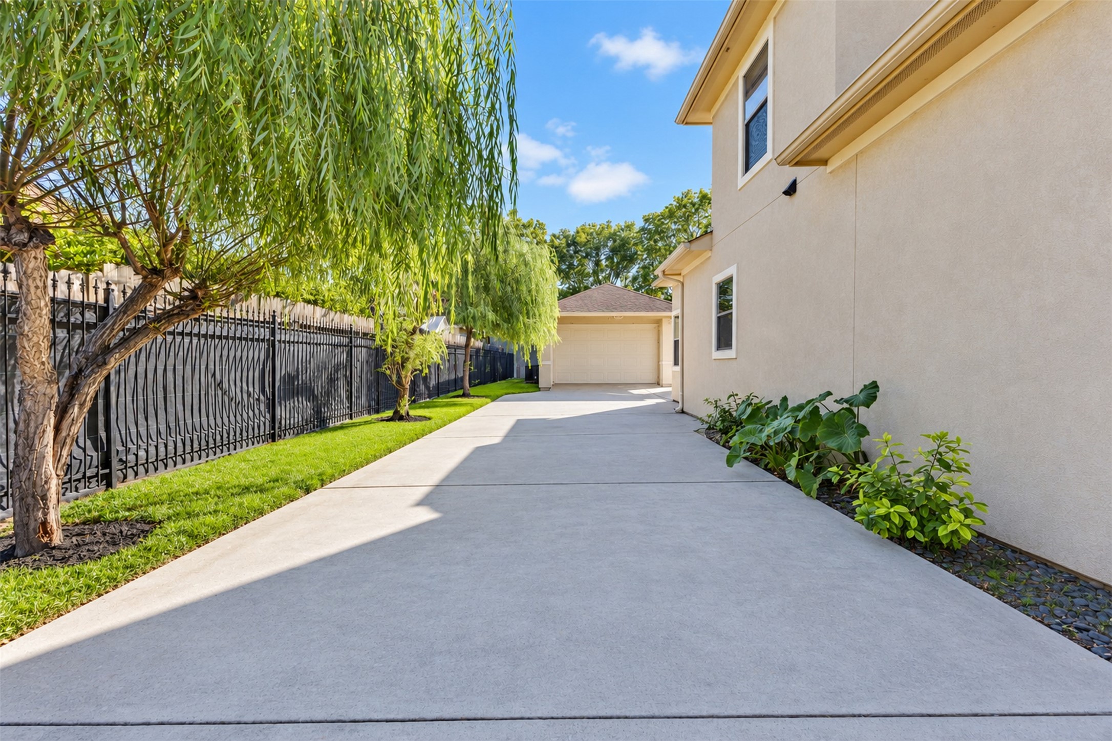 Garage and Driveway: Detached garage with a spacious U-shaped driveway, offering convenient access and additional guest parking.