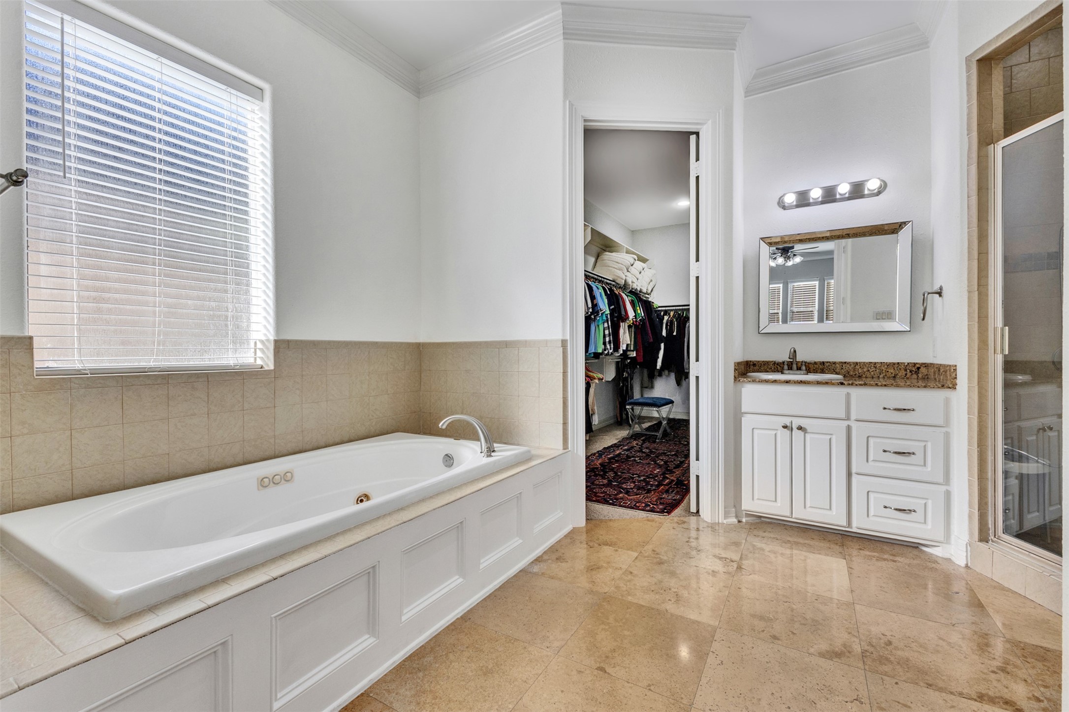 Primary Bathroom: The primary bathroom complements the suite with a dedicated space for your daily routine.