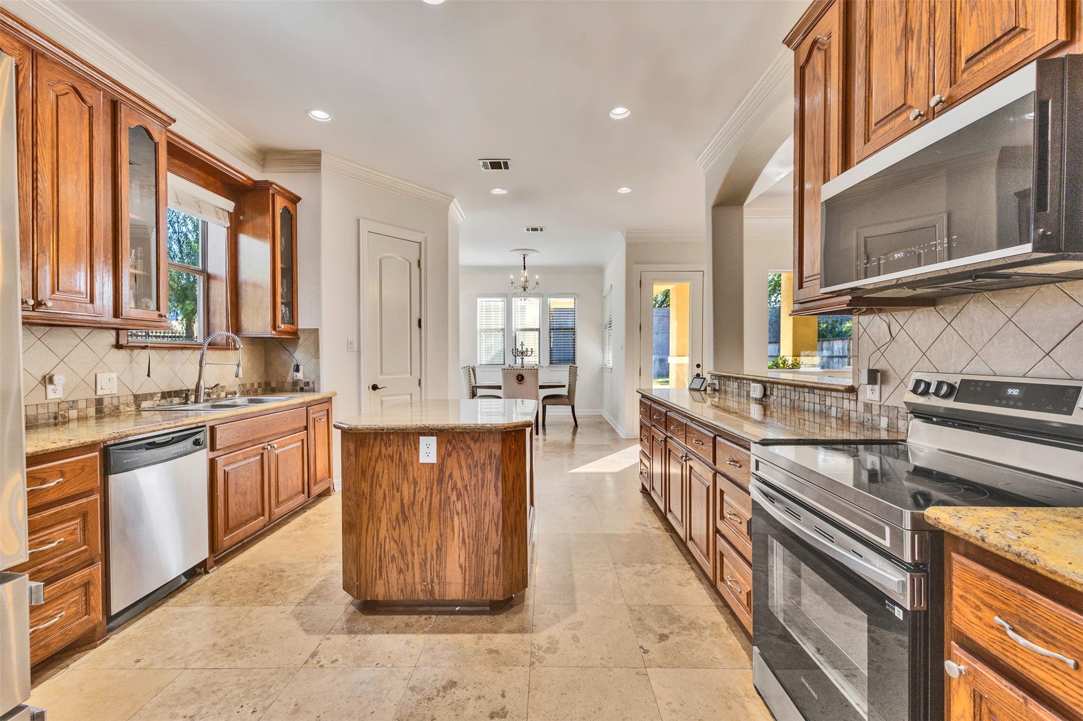 Kitchen: An inviting island kitchen opens to the living area, creating a connected space for everyday cooking and entertaining.