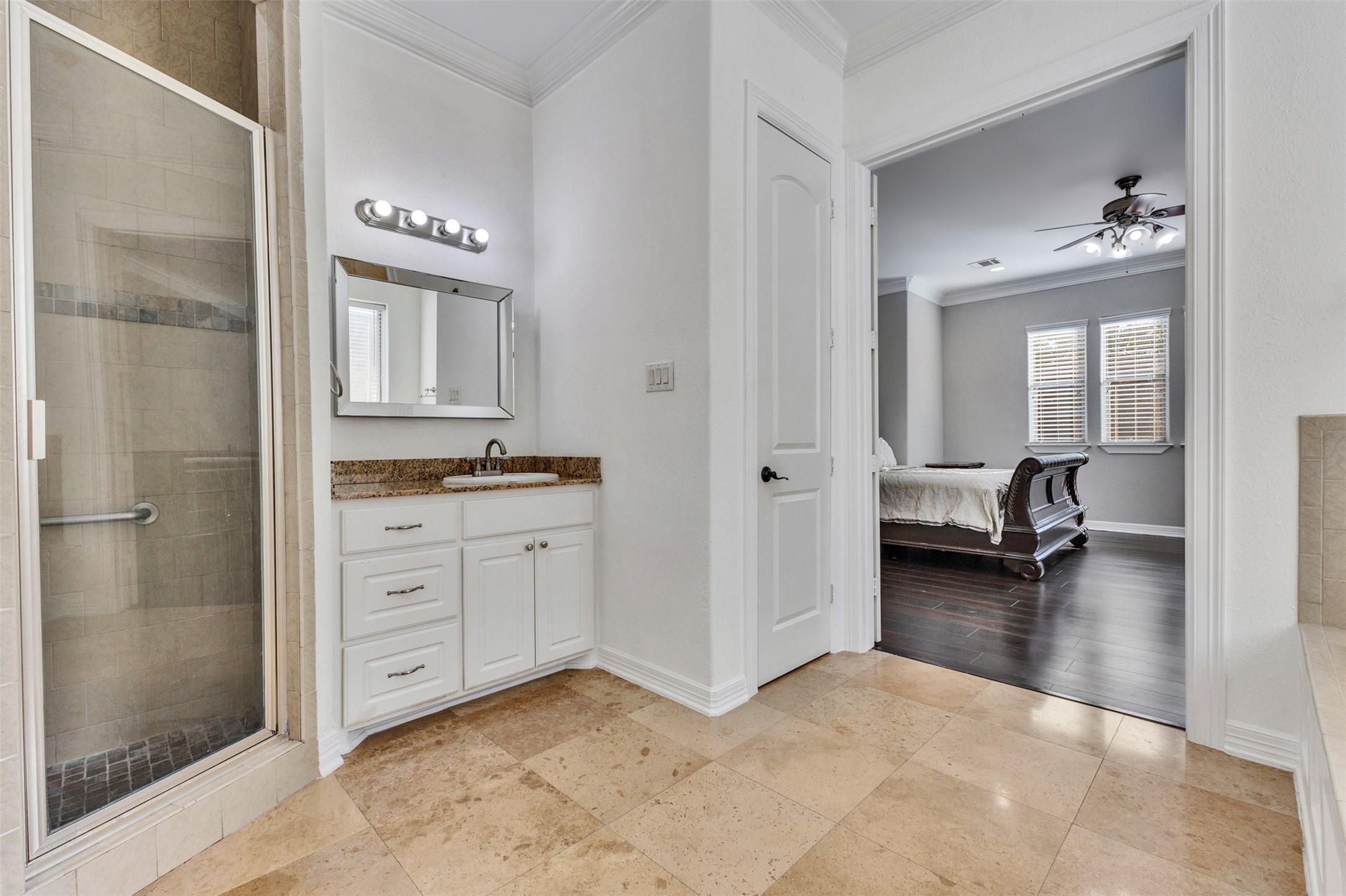 Primary Bathroom: The primary bathroom complements the suite with a dedicated space for your daily routine.