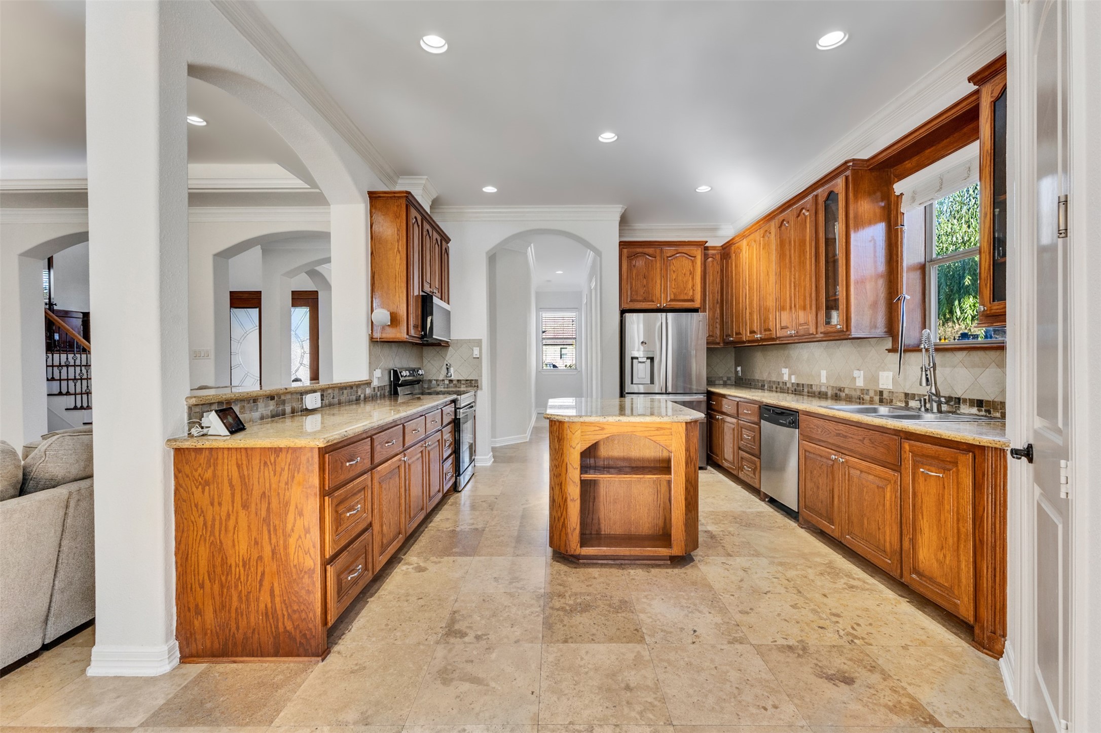 Kitchen: An inviting island kitchen opens to the living area, creating a connected space for everyday cooking and entertaining.