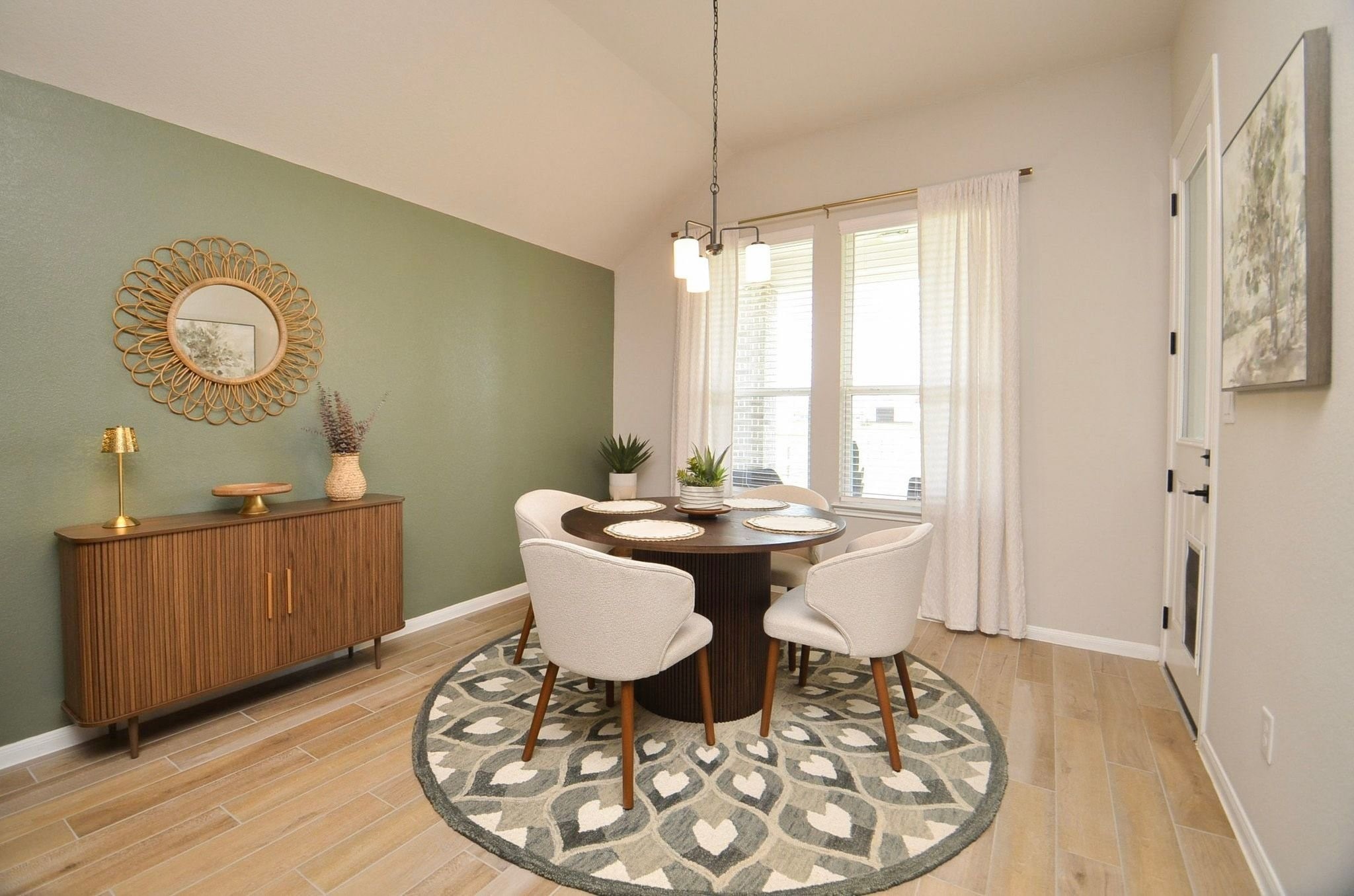 Spacious dining area with large windows and great views of the extended covered patio and back yard- very peaceful views!
