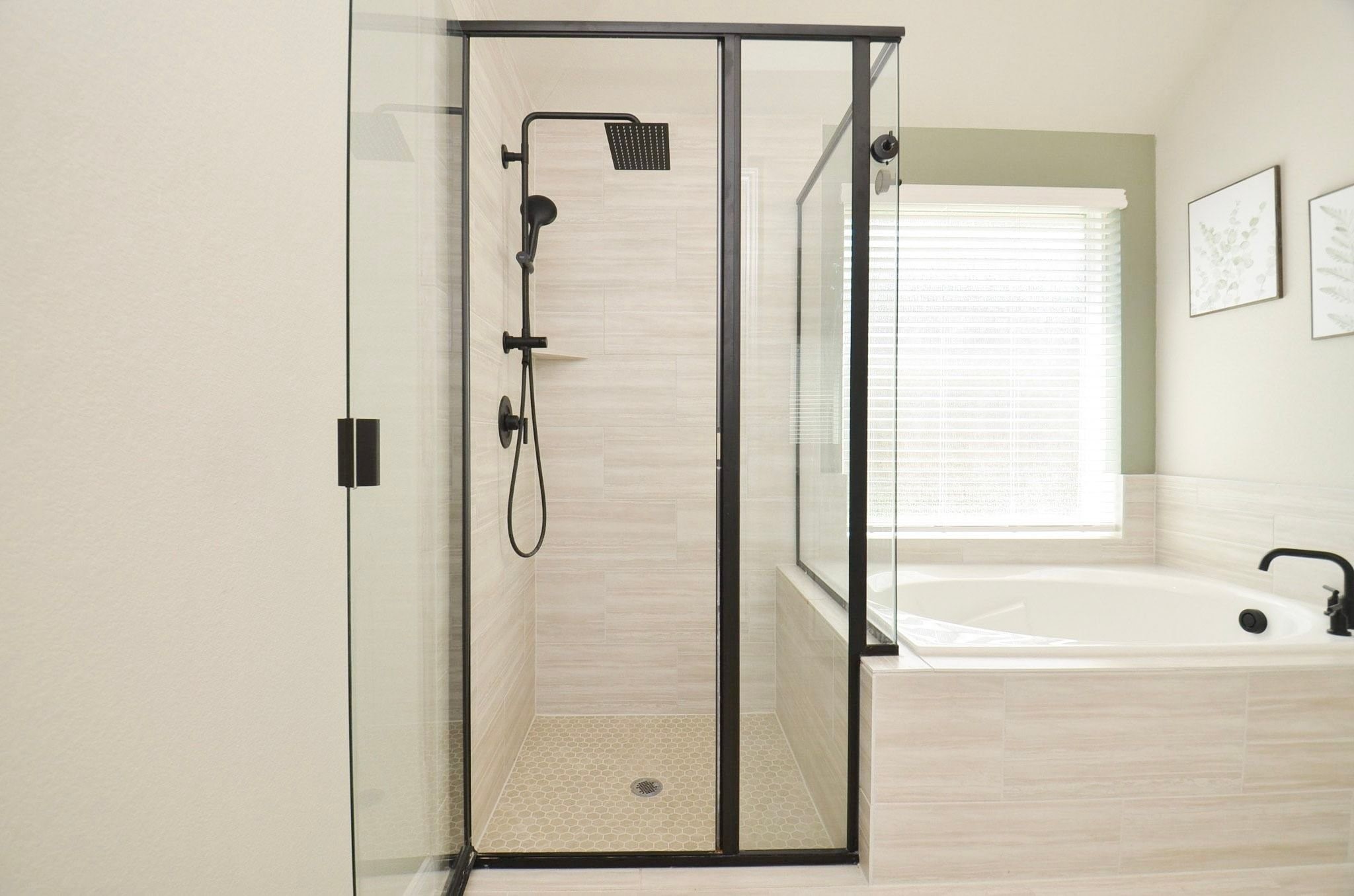 View of the tile work inside the large primary shower