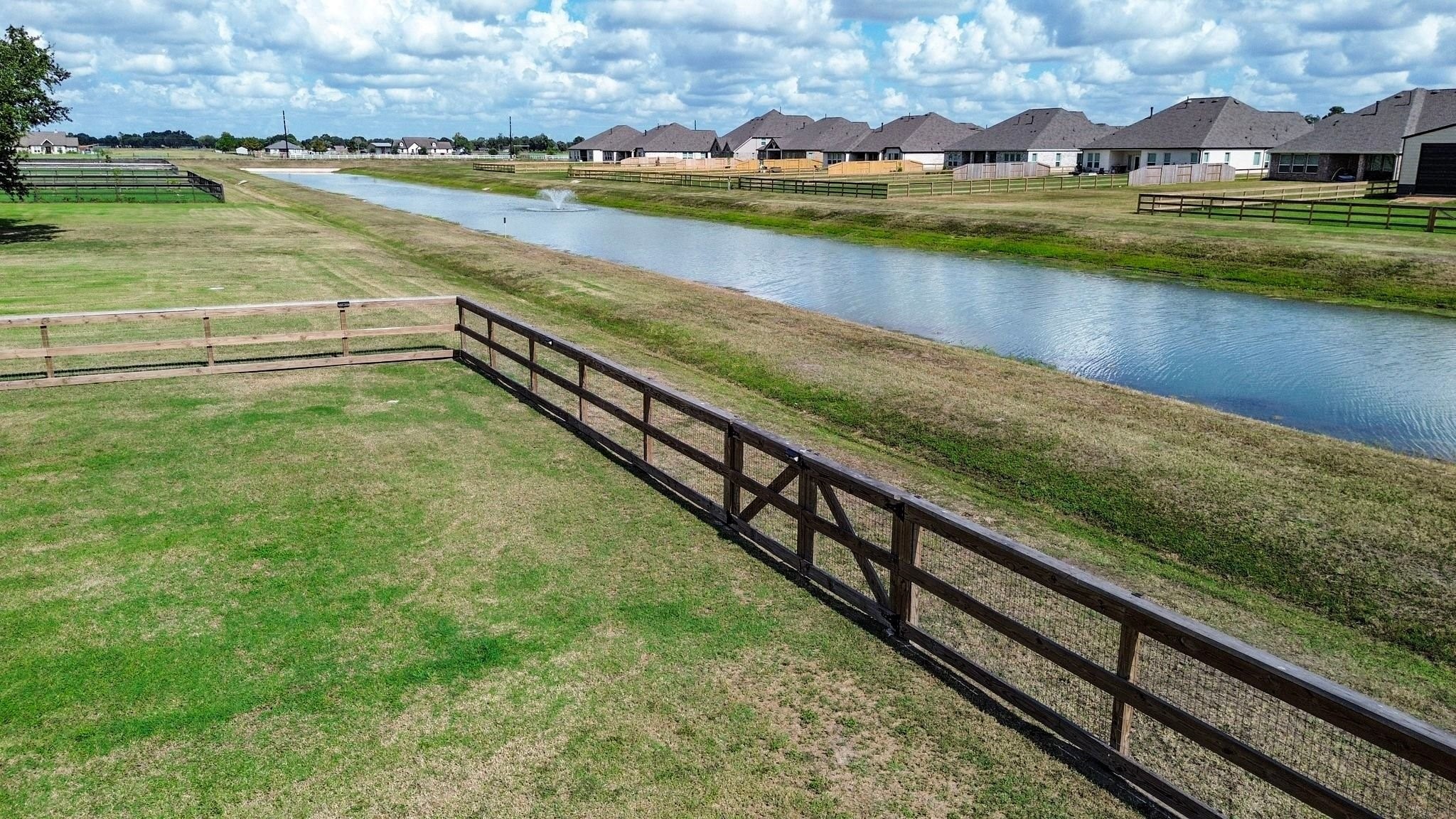 Fully fenced back yard with gate to access the green space