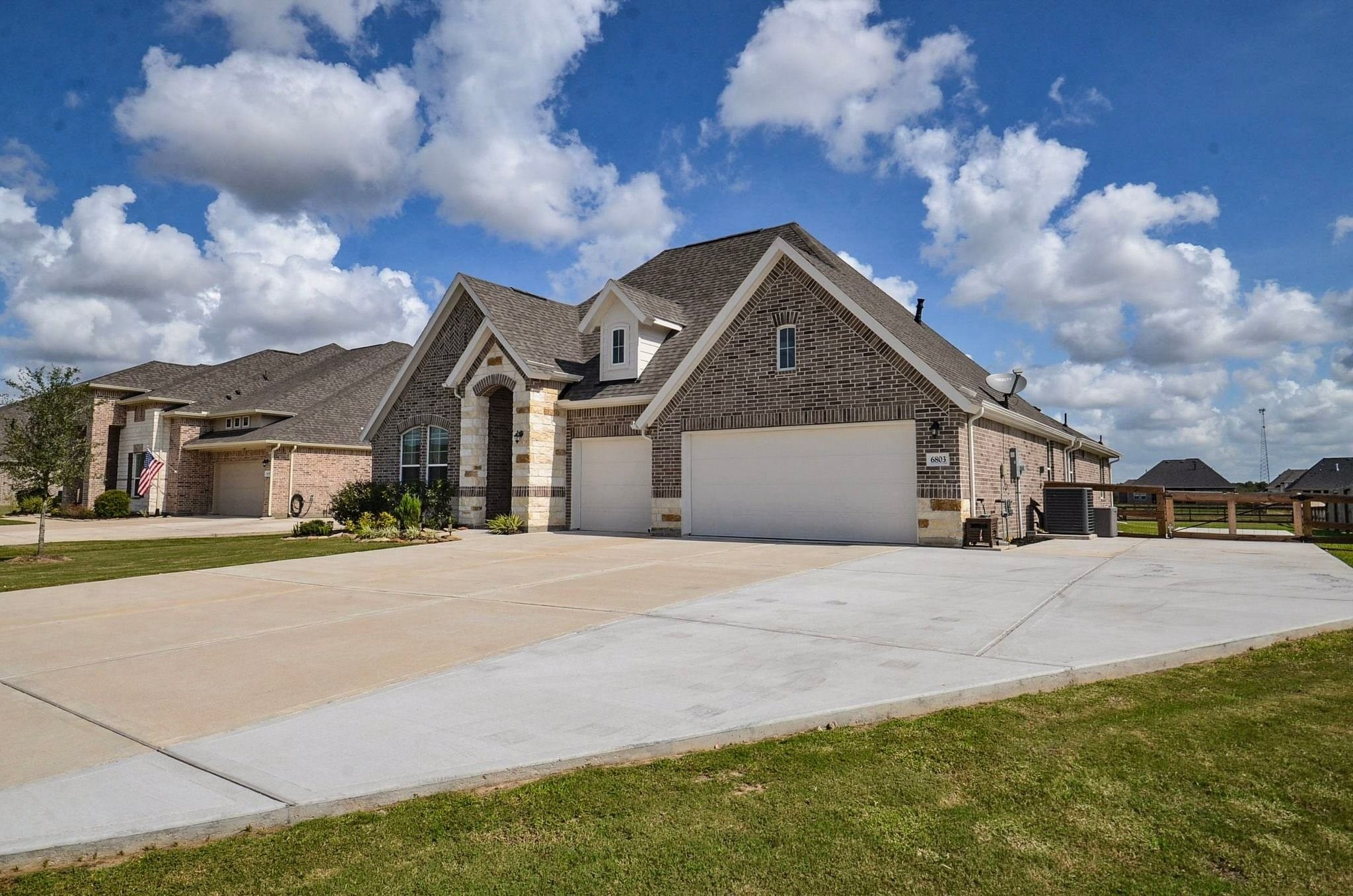 THREE car garage, EXTRA WIDE driveway- plenty of parking and the owners extended the drive around the side of the house
