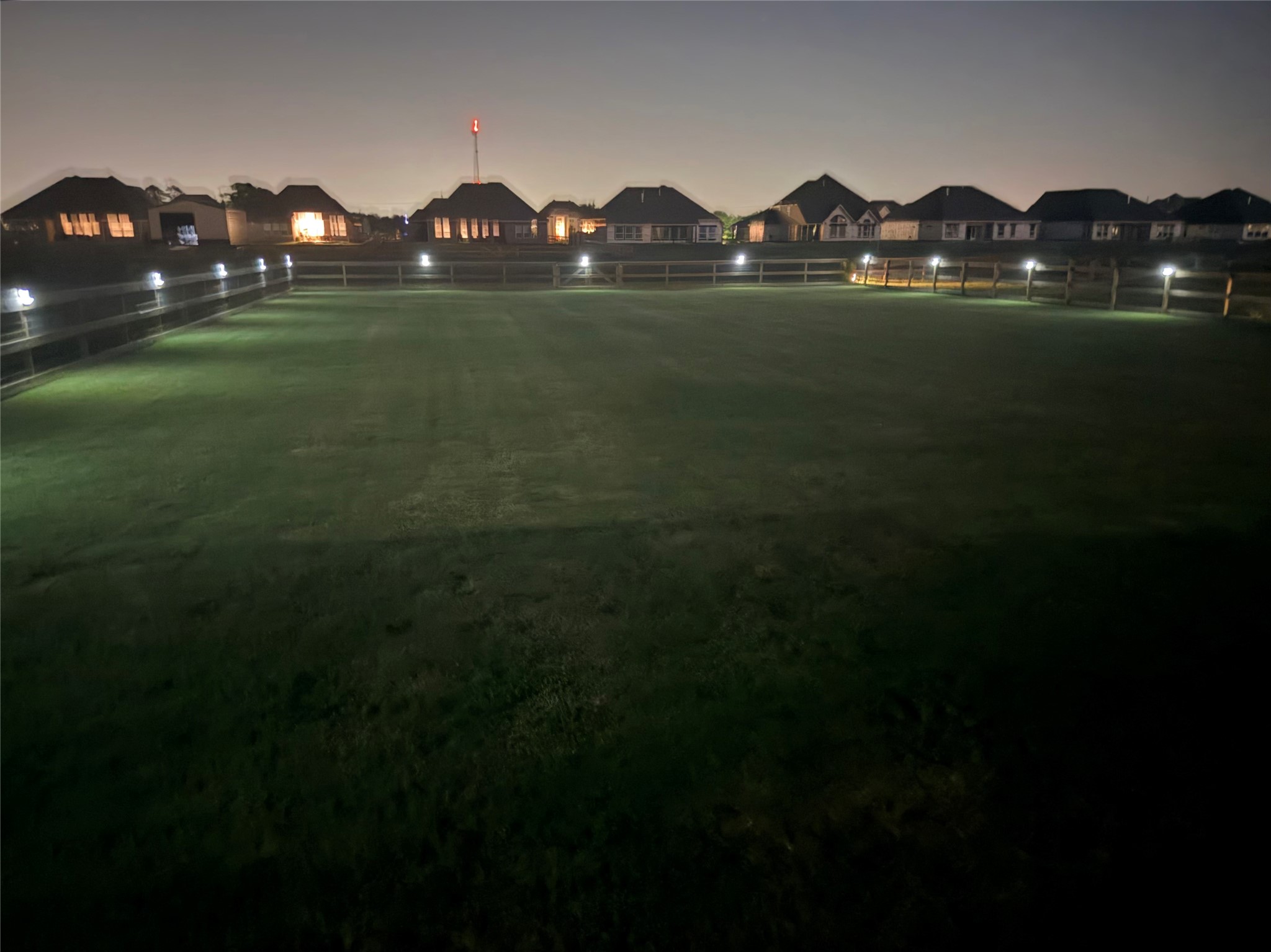 Love this night shot- motion lights all around the fence