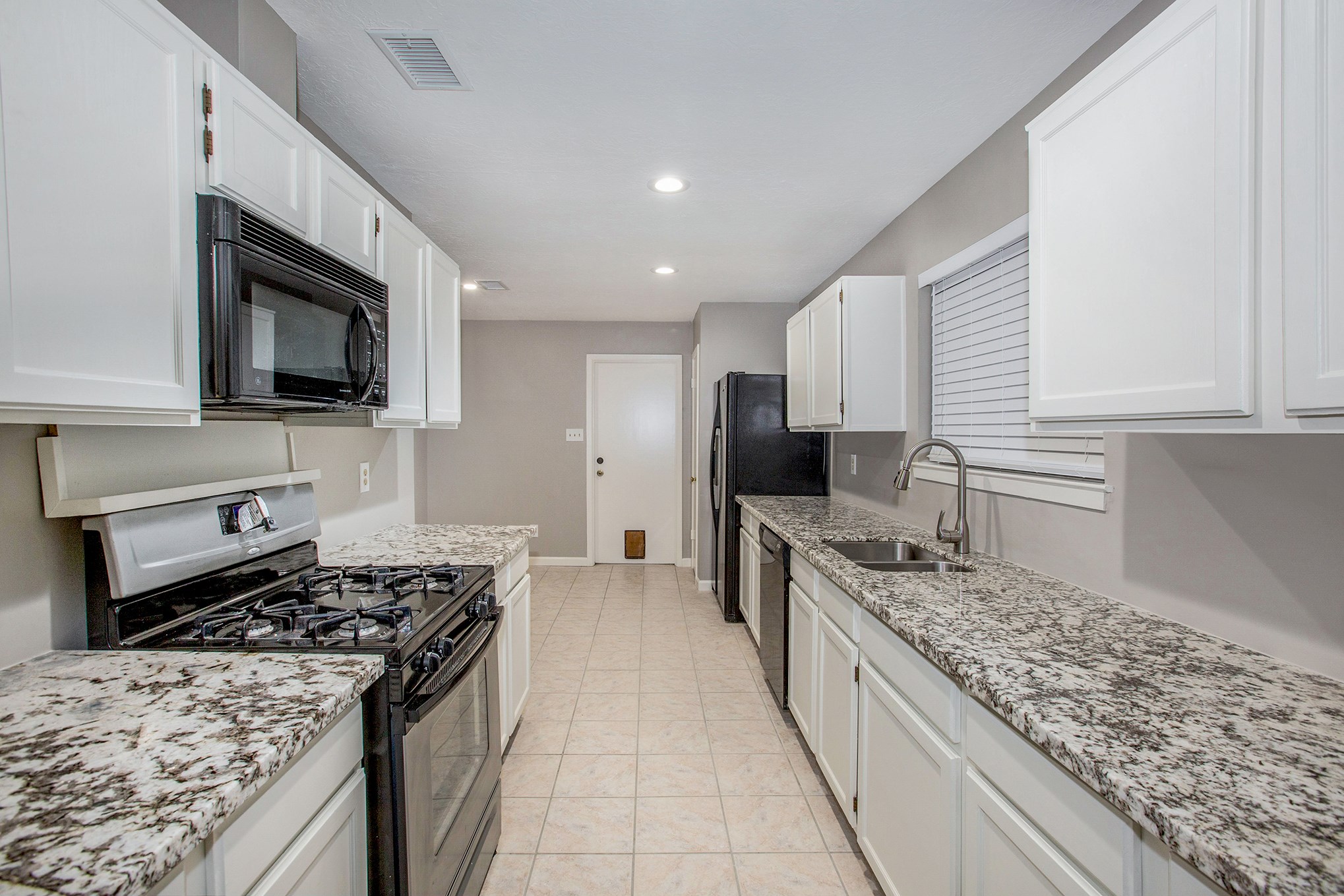 Great kitchen with gorgeous granite countertops, white cabinets, gas cooktop, stainless steel sink and faucet. Great kitchen with gorgeous granite countertops, white cabinets, gas cooktop, stainless steel sink and faucet.