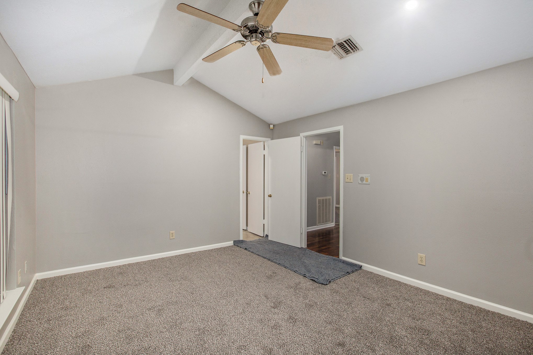 Spacious master bedroom boasts plush carpet, vaulted ceiling and ceiling fan. Spacious master bedroom boasts plush carpet, vaulted ceiling and ceiling fan.