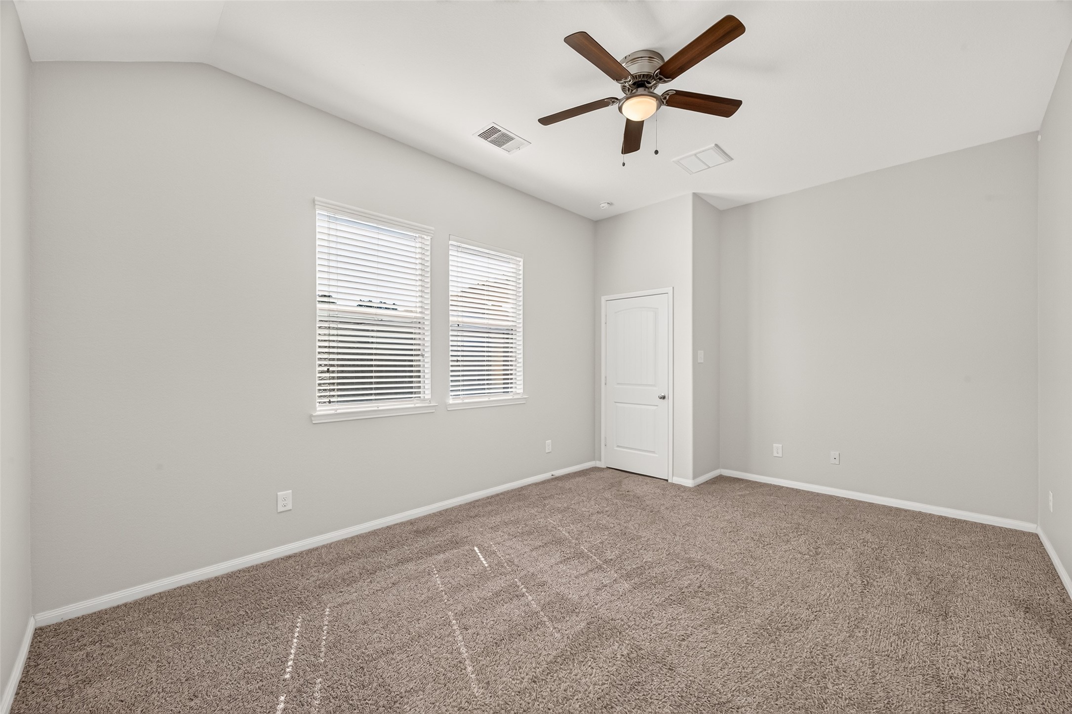 Another view of the primary bedroom, located just off the main living area.