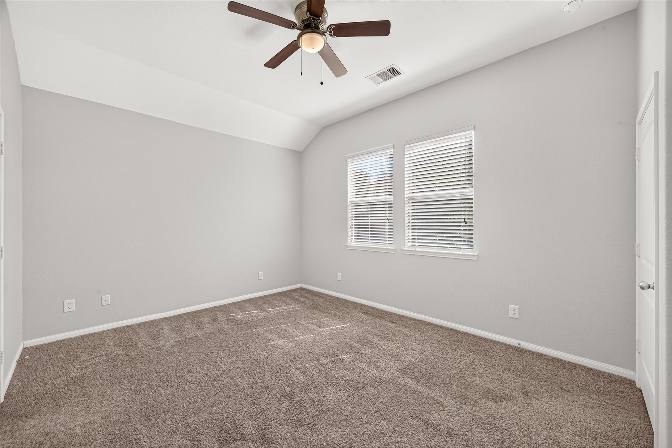 Natural light creates a comfortable and peaceful primary bedroom setting.