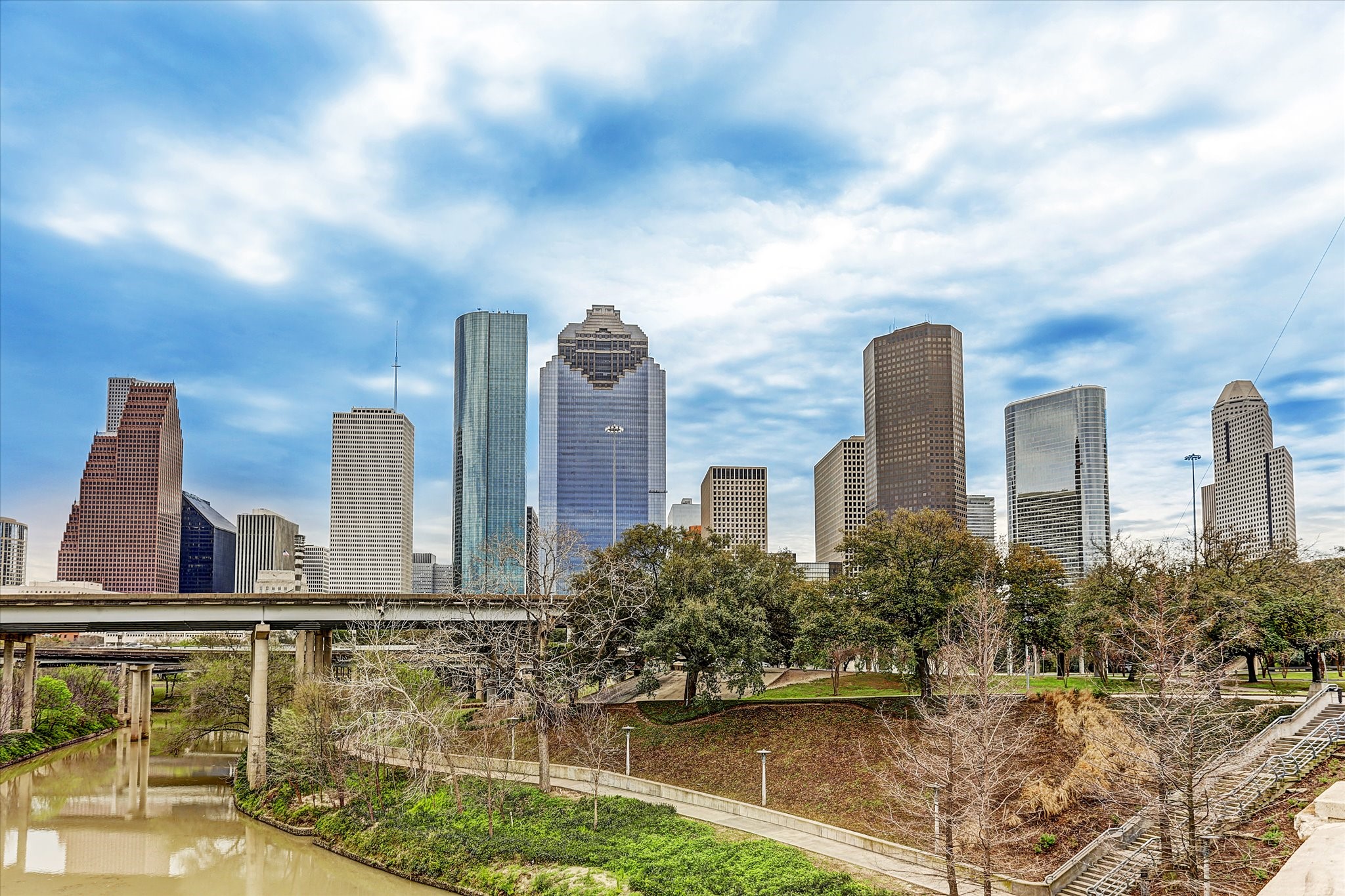 Stretching for miles along the waters edge, Buffalo Bayou Park offers a rare balance of urban energy and natural escape. Winding hike-and-bike trails weave beneath towering oaks and open lawns, connecting runners, cyclists, and casual strollers to sweeping views of the downtown skyline. With kayak launches, dog parks, and cultural landmarks nearby, Buffalo Bayou Park is more than green space, its the citys outdoor living room.