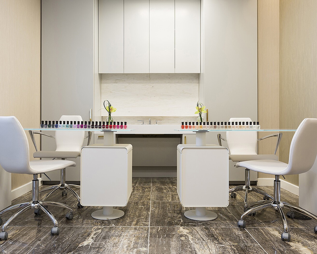 On-site nail salon offering manicure and pedicure services in a bright, modern setting.