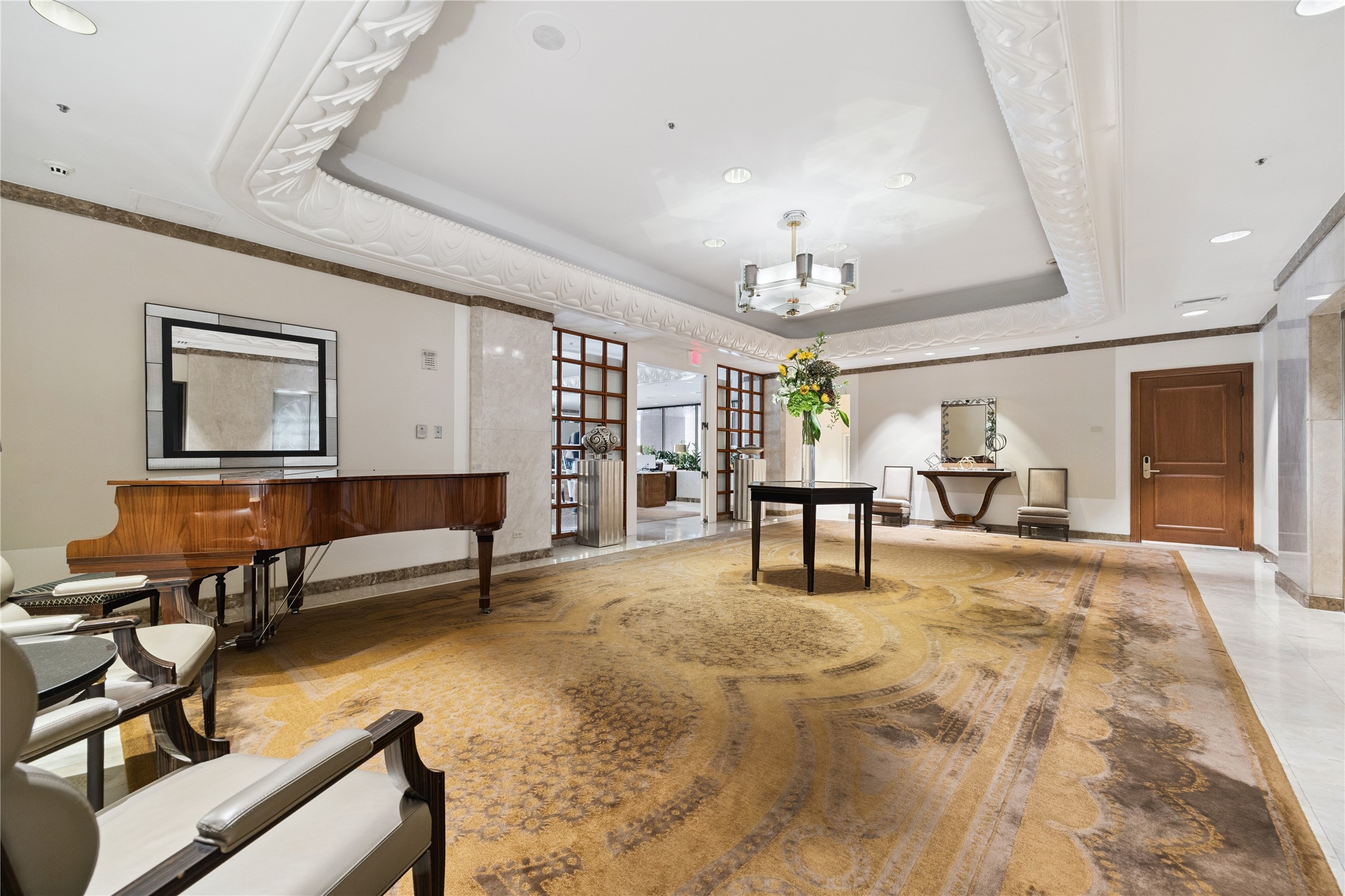 The elevator lobby offers a refined transition space with classic detailing and comfortable seating. Reserved exclusively for private residences, it combines privacy with the same elevated atmosphere found throughout the Four Seasons.