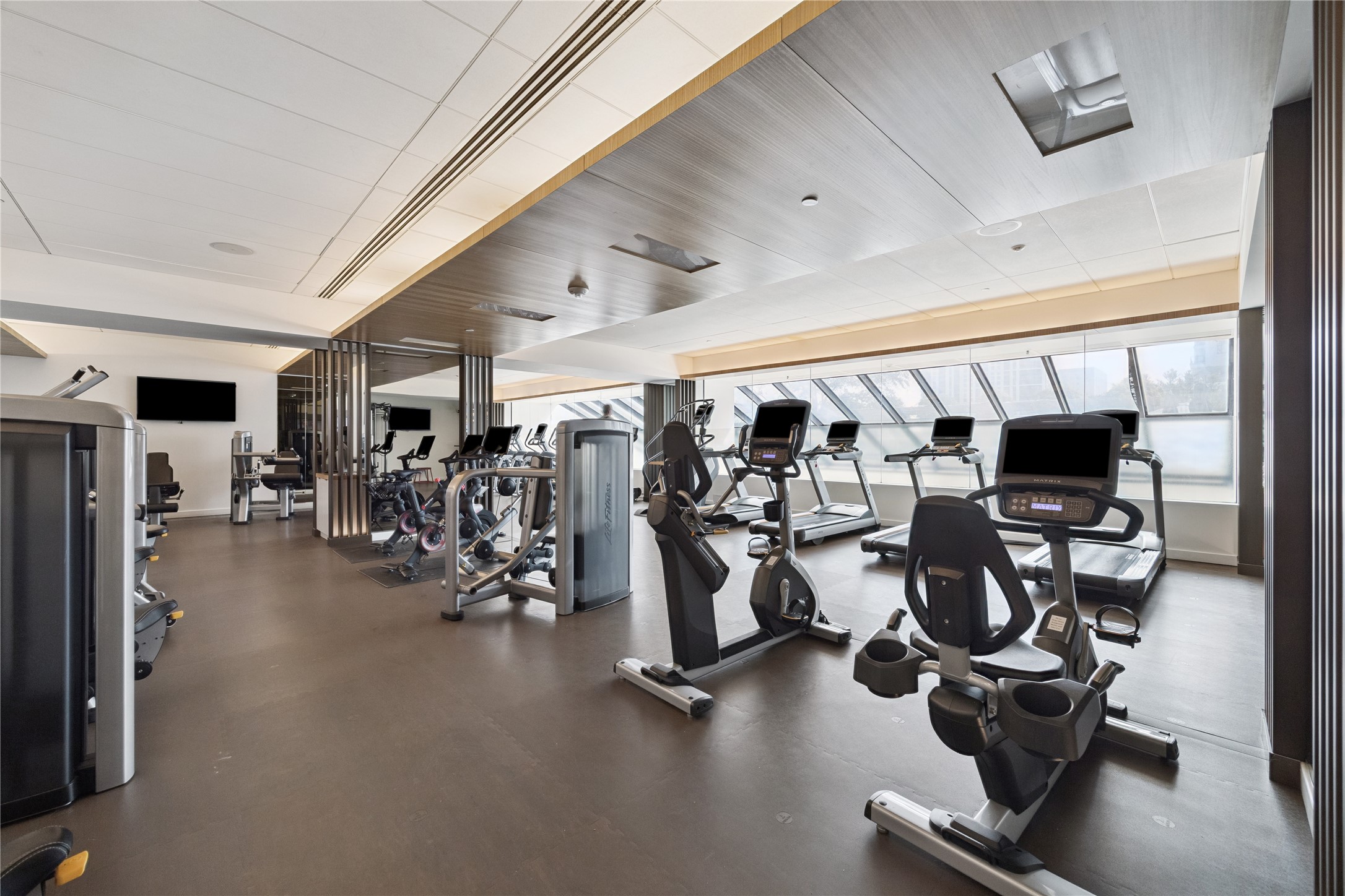 The gym features a full range of cardio and strength training machines in a bright, spacious setting. Open around the clock, it provides residents with the convenience of professional wellness facilities.