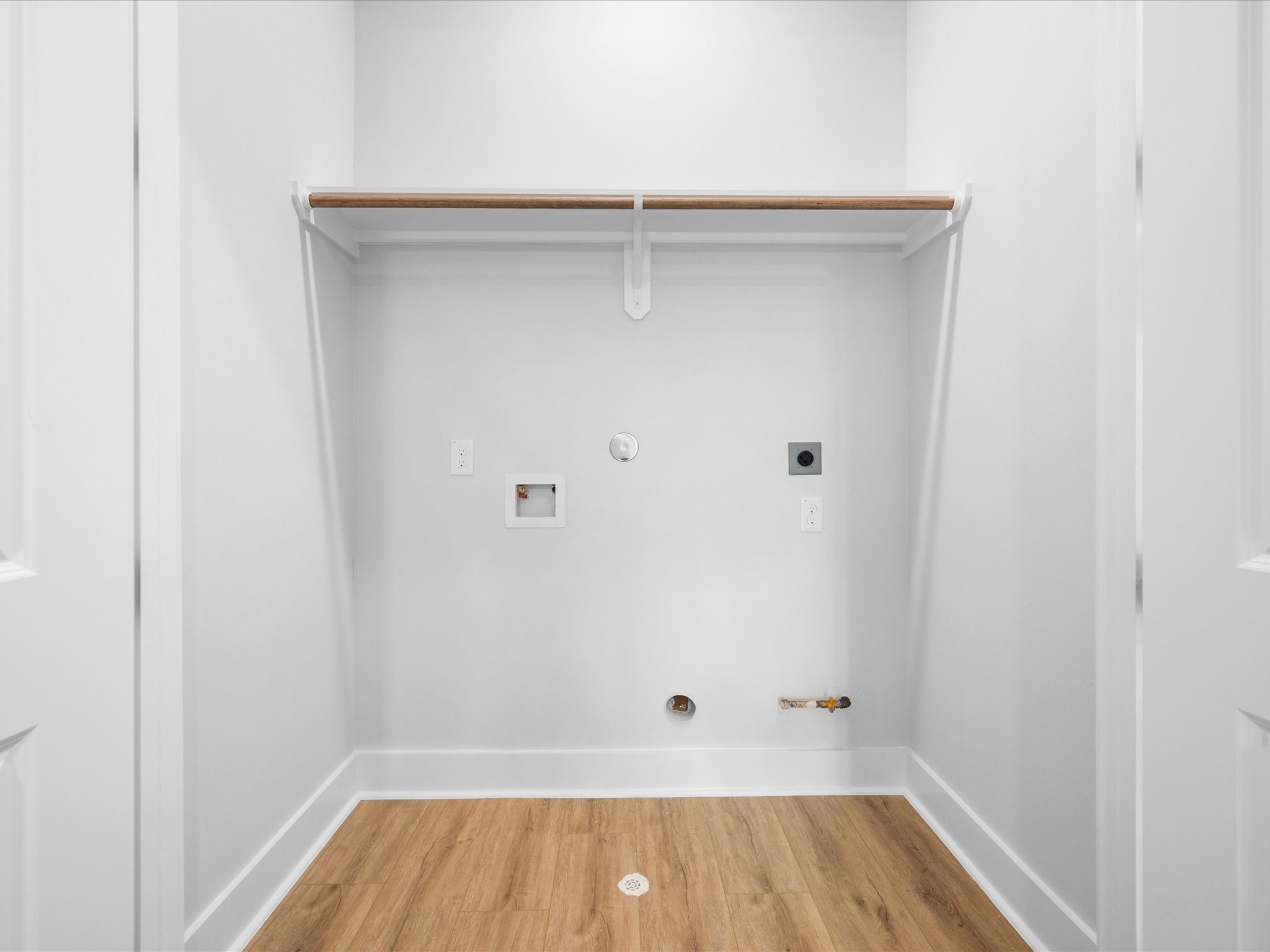 A dedicated utility room adds everyday convenience, keeping laundry tucked away within the home.