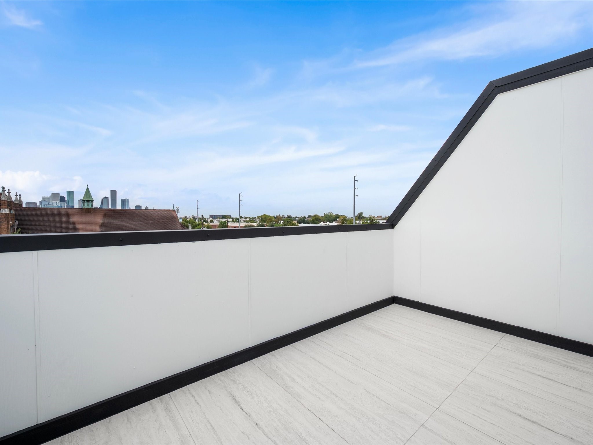 The Houston skyline provides a striking backdrop from this private rooftop retreat, bringing the energy of downtown living right to your doorstep.