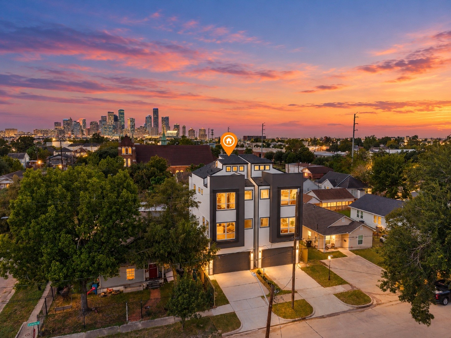 Modern architecture and sophisticated design set the tone for this stunning new construction home in EaDo, where contemporary urban living meets impressive downtown Houston views. Virtually enhanced with AI to showcase twilight setting.
