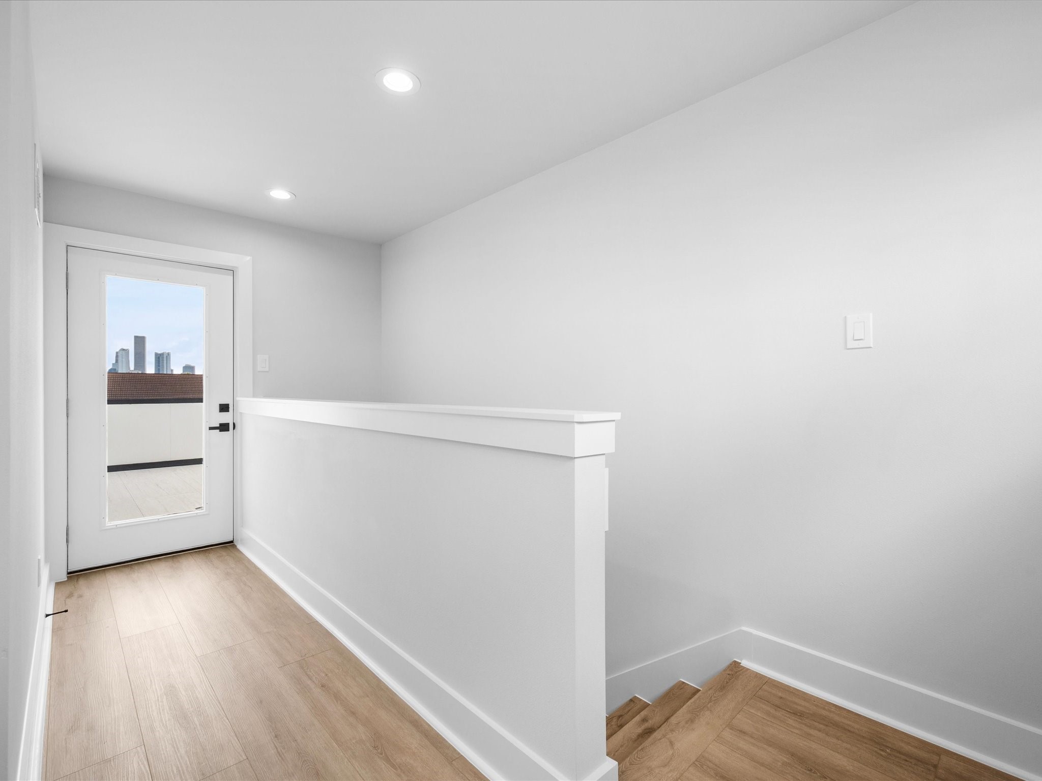 A private staircase leads to the rooftop terrace on the fourth floor, where elevated outdoor living awaits.