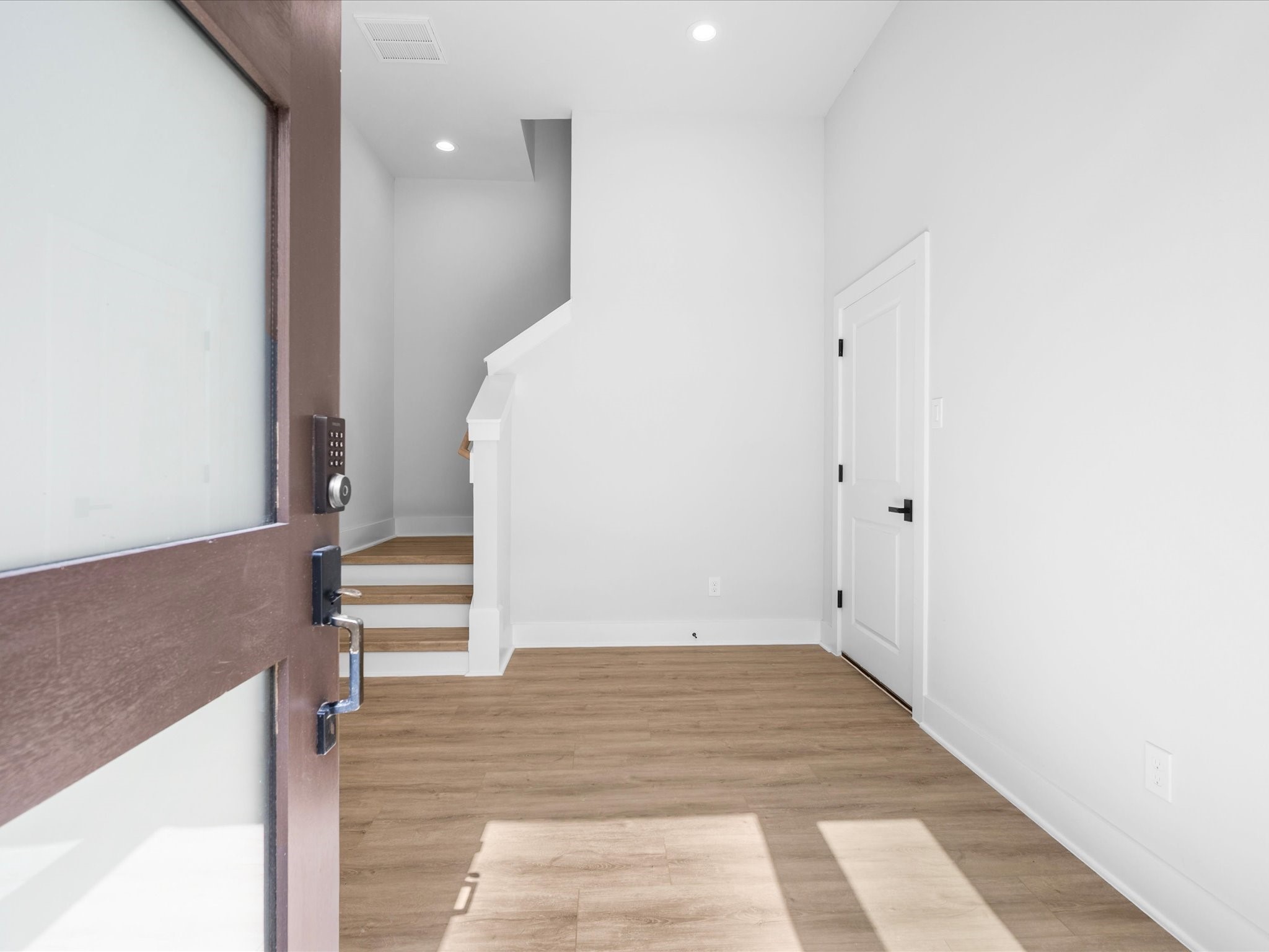 A welcoming entry introduces the home's contemporary style, setting the stage for thoughtfully designed interiors and elevated modern finishes throughout.