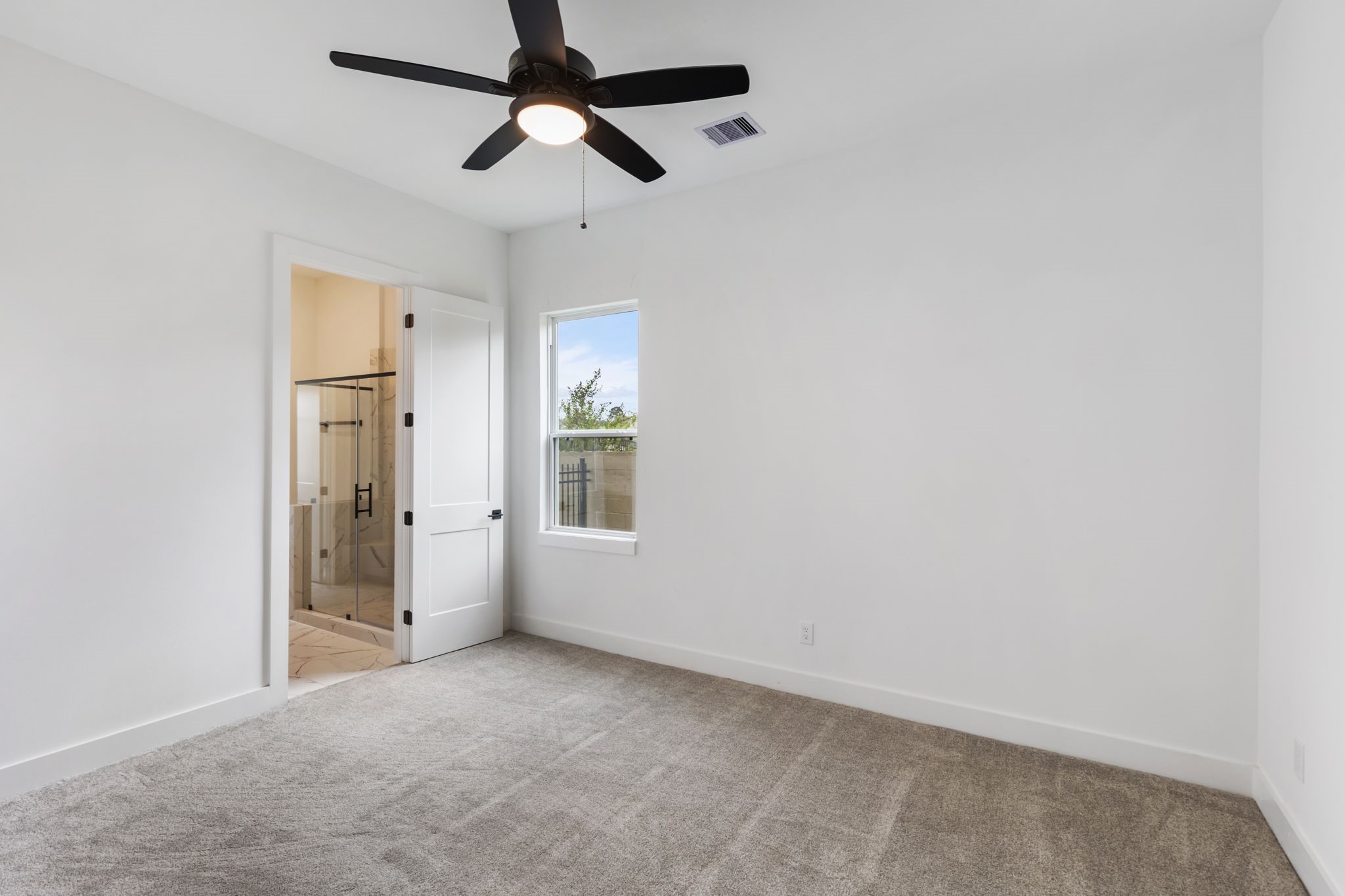 Secondary bedroom on first floor with ensuite bathroom.