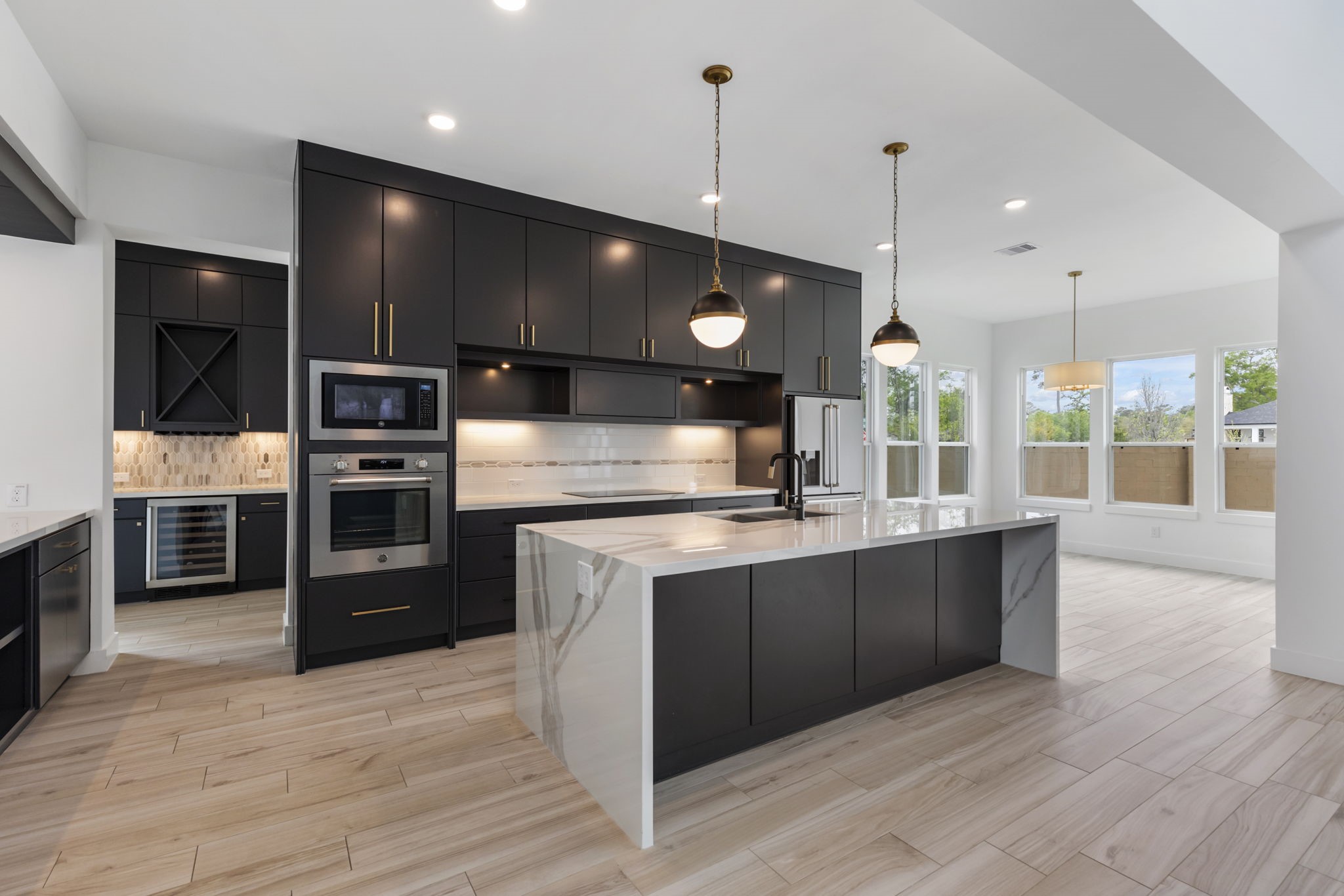 Sleek kitchen with breakfast bar.