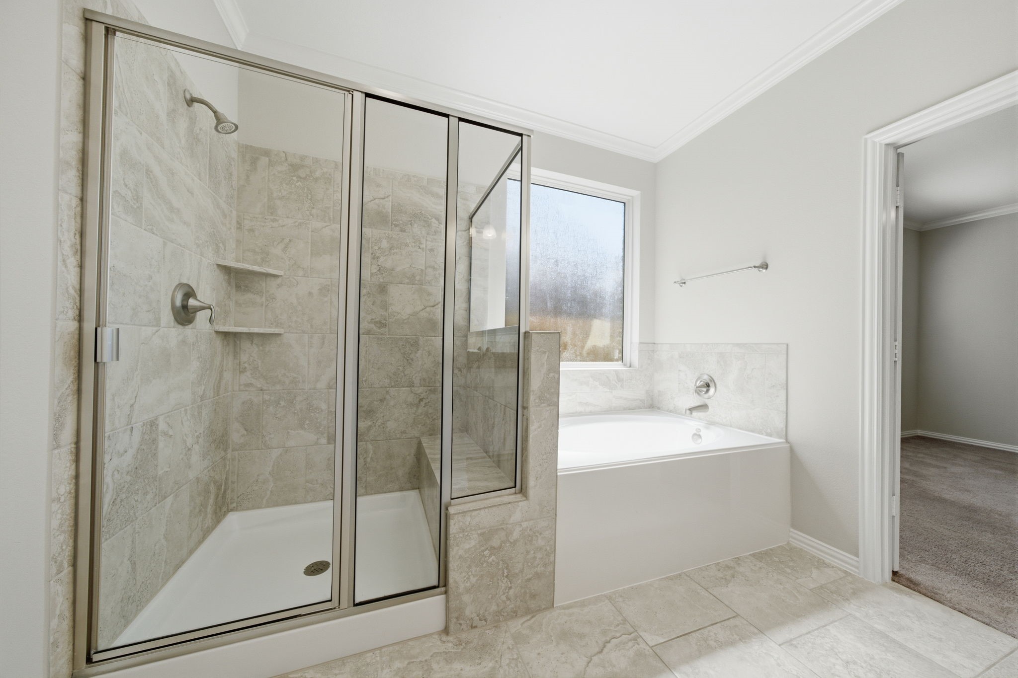 Primary bathroom features a walk-in shower and separate tub