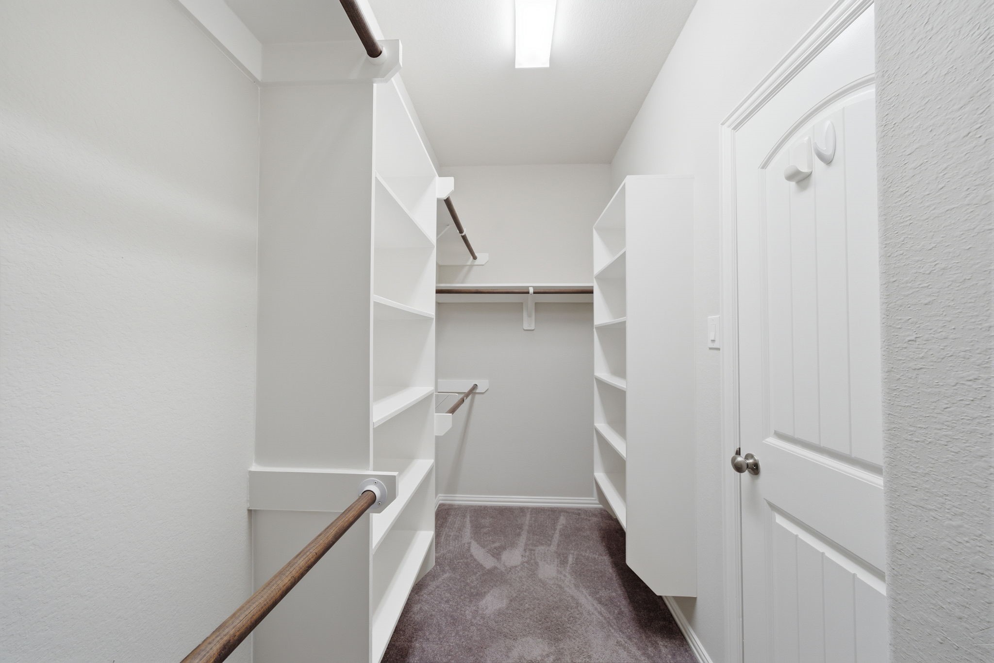 Walk-in closet located in the primary bedroom
