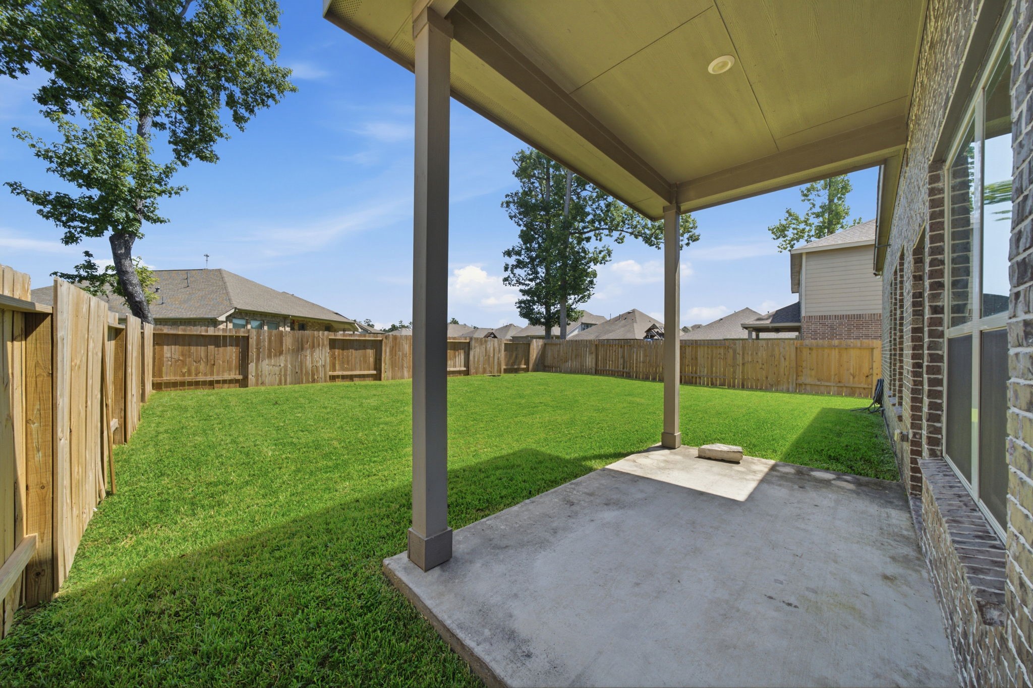 Fully fenced backyard and covered patio