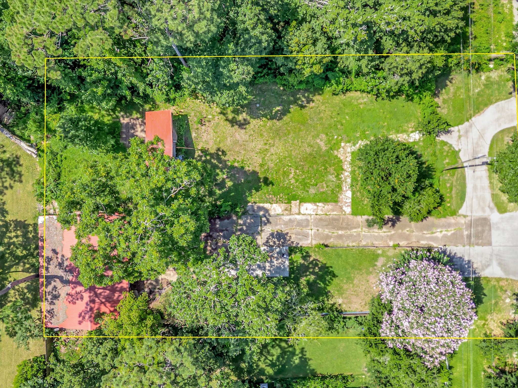 Beautiful buildable lot with a three car garage, power, water and sewer, driveways and more
