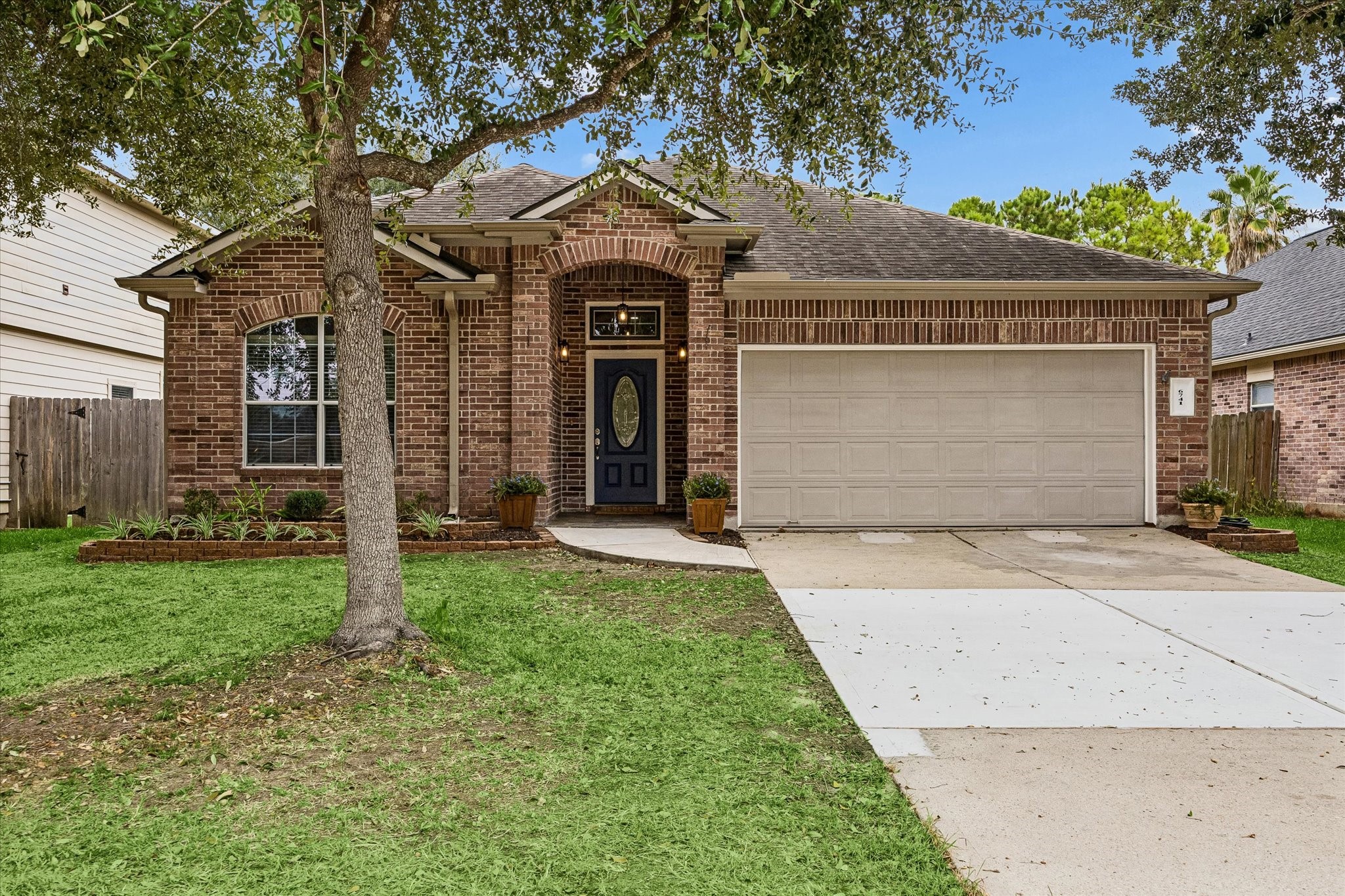 Experience the charm of this home with its newly landscaped exterior and inviting slate stone entryway, perfect for creating a warm welcome.