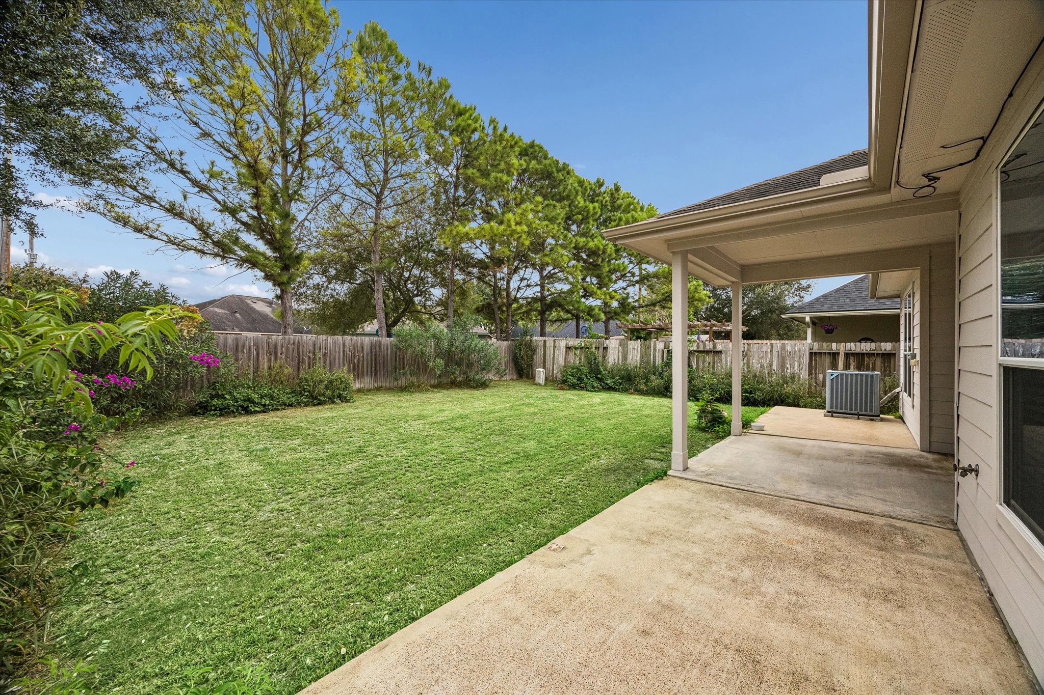 Enjoy seamless entertaining in the spacious backyard featuring an inviting extended patio.