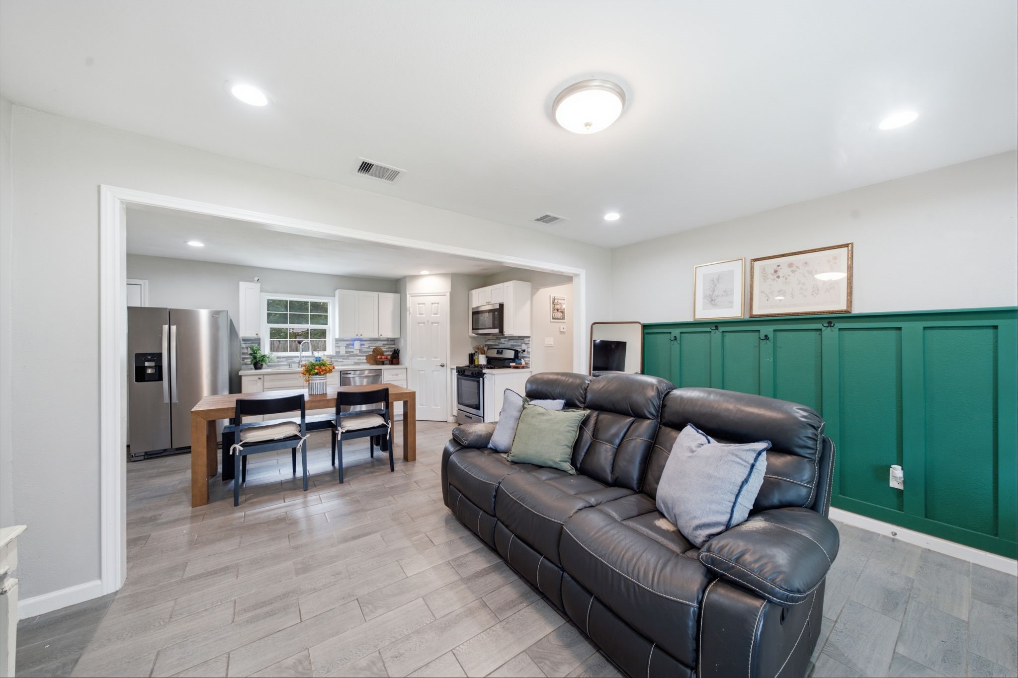 Living room open to kitchen and dining