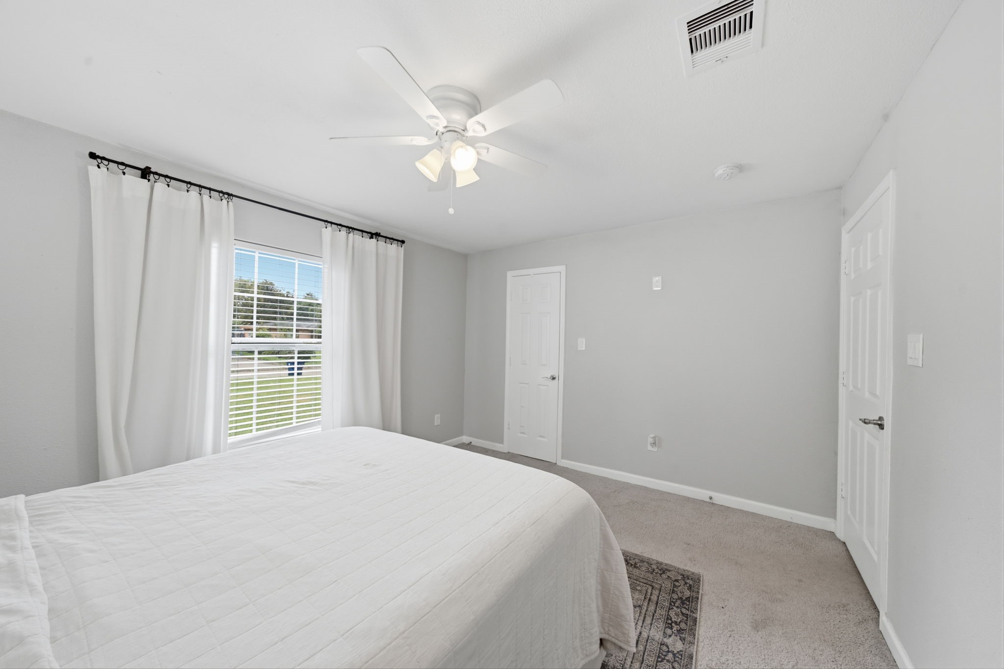Primary bedroom with walk-in closet