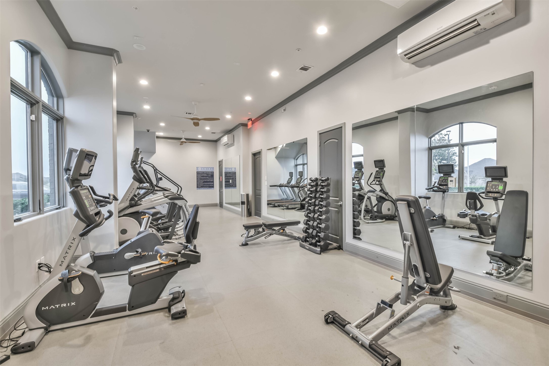 The fitness center includes a variety of workout machines.