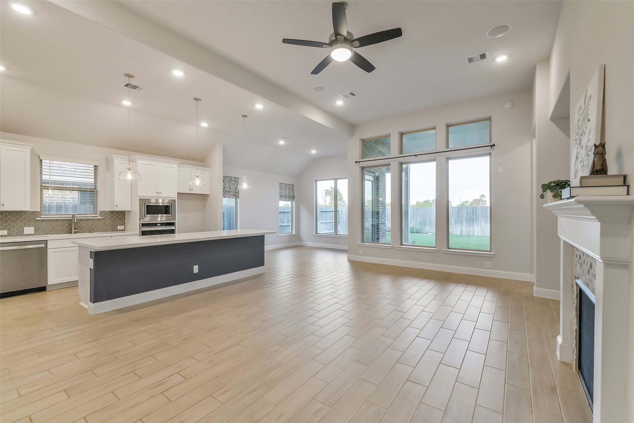 Activities can move seamlessly from area to the next in this open floor plan.