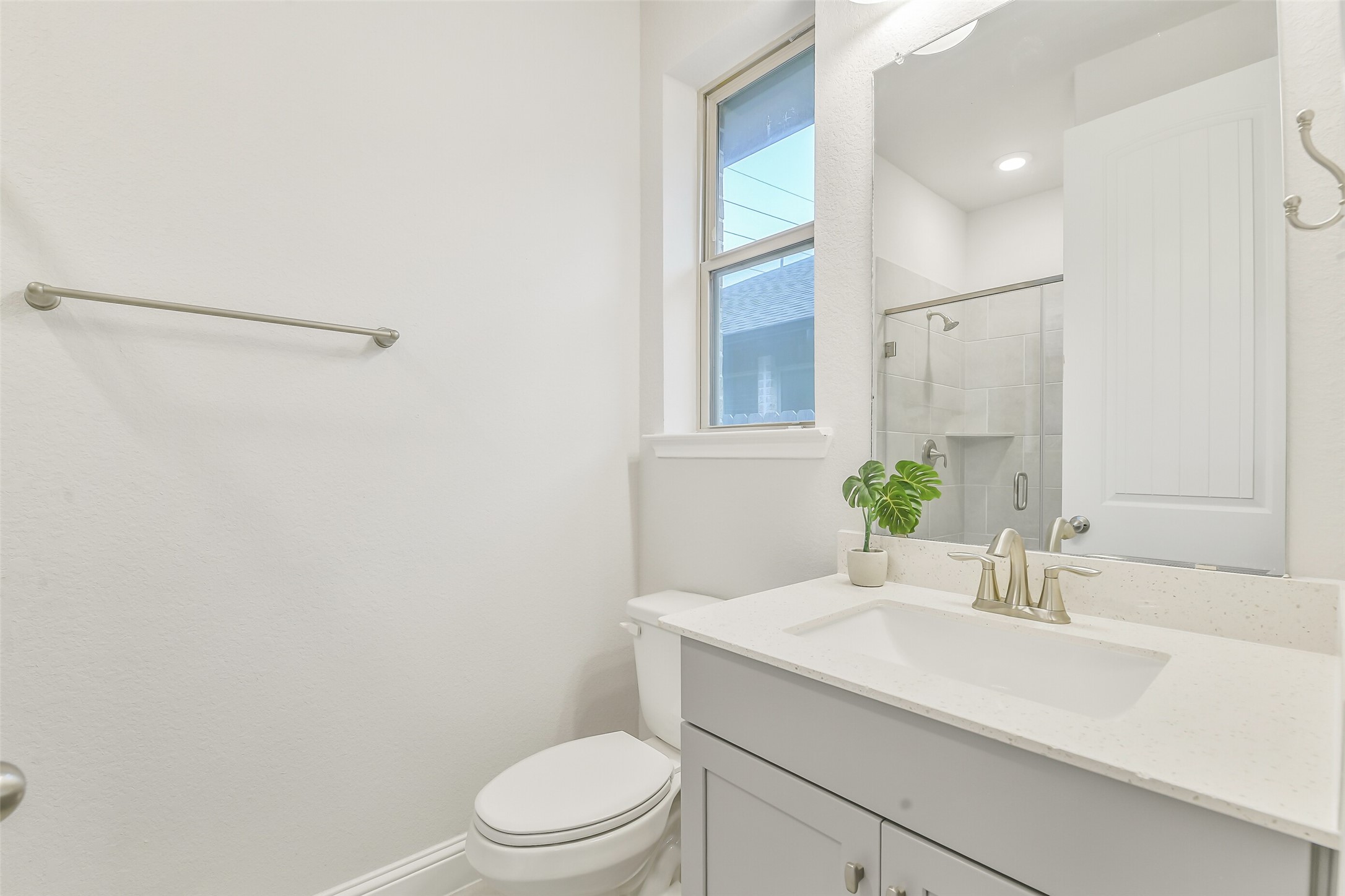 This secondary bedroom features an ensuite bathroom.