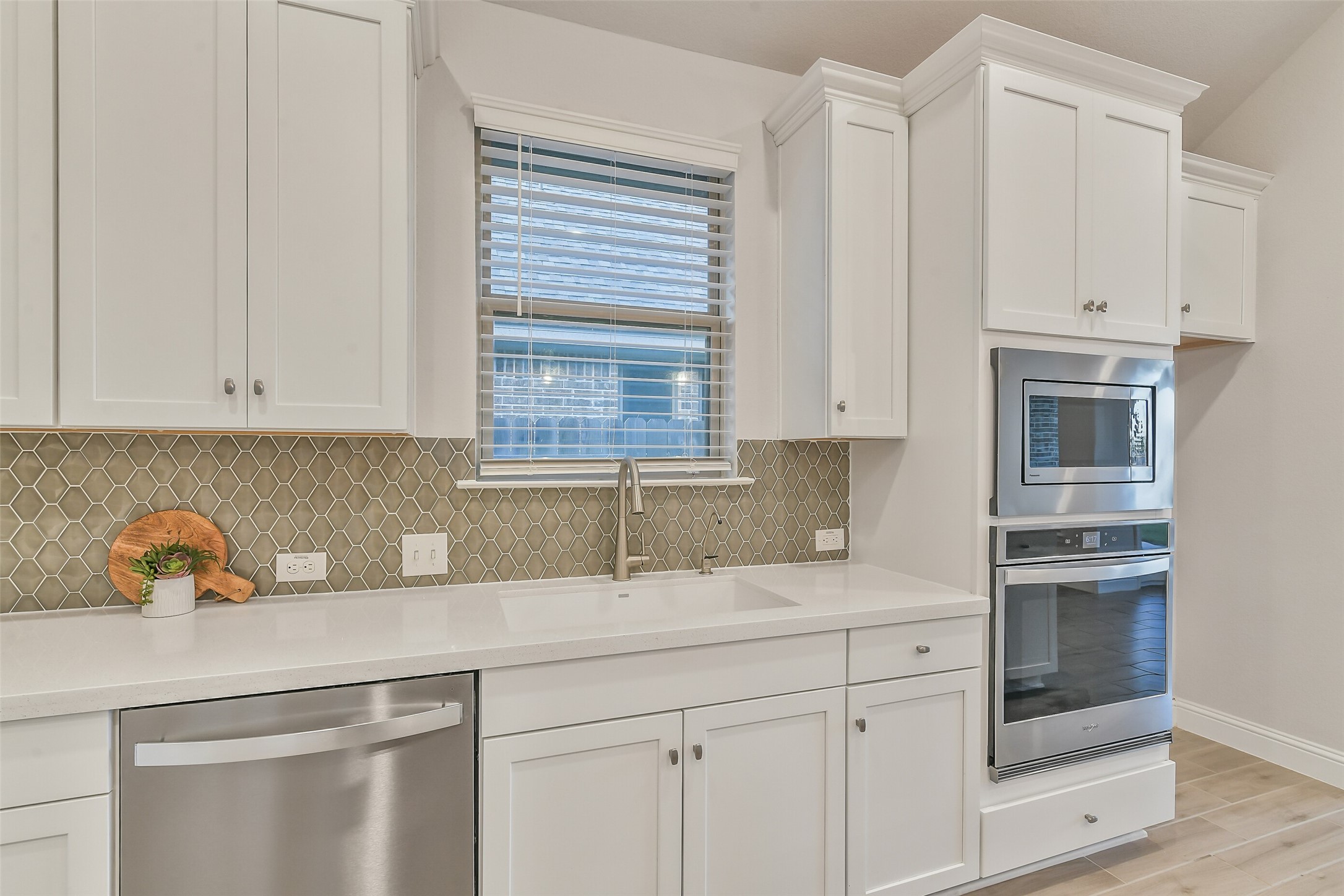 Plenty of natural light flows into the kitchen with this window situated above the sink.