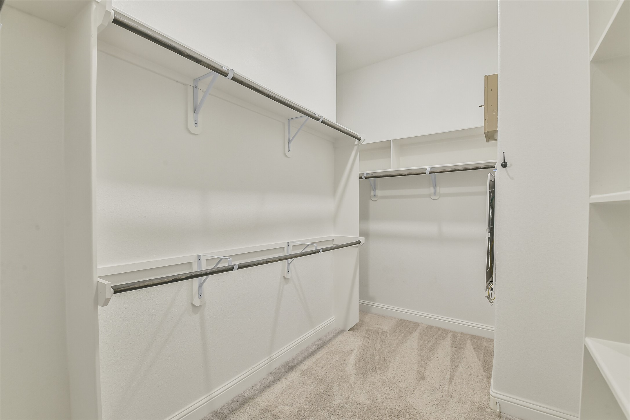 Large walk-in closet with an abundance of space.
