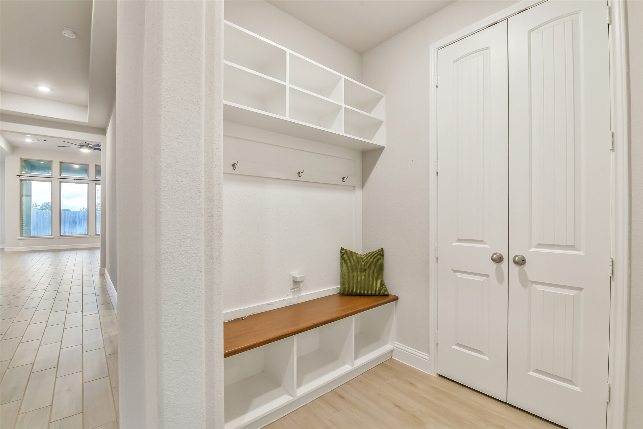 The mudroom with custom wood bench is conveniently located directly off the garage.