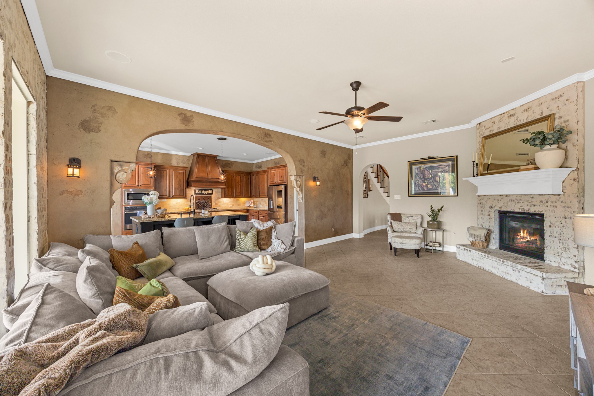 Spacious family room designed for comfortable everyday living and entertaining, with an open layout connecting the kitchen and dining areas.