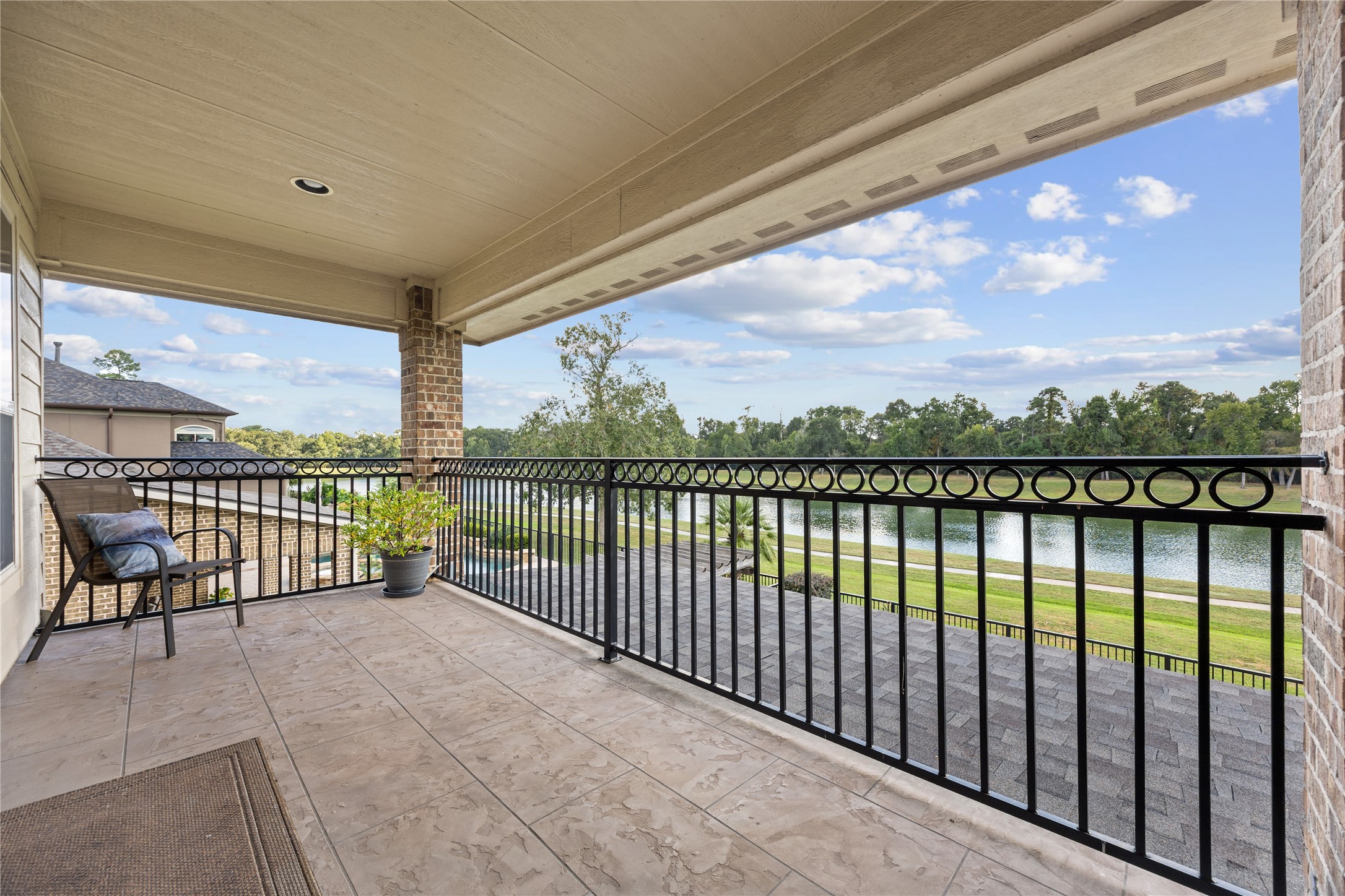 Take in the beautiful water views from your private covered upstairs balcony! An inviting place to enjoy morning coffee, fresh air, or a peaceful evening outdoors.