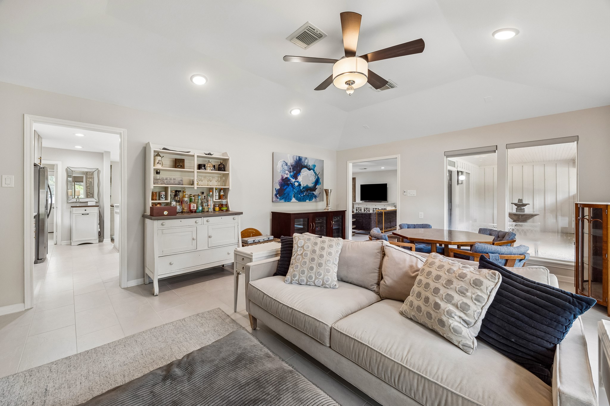 Open to the kitchen and living room, this versatile space offers abundant natural light and a seamless, welcoming flow to the rest of the house.