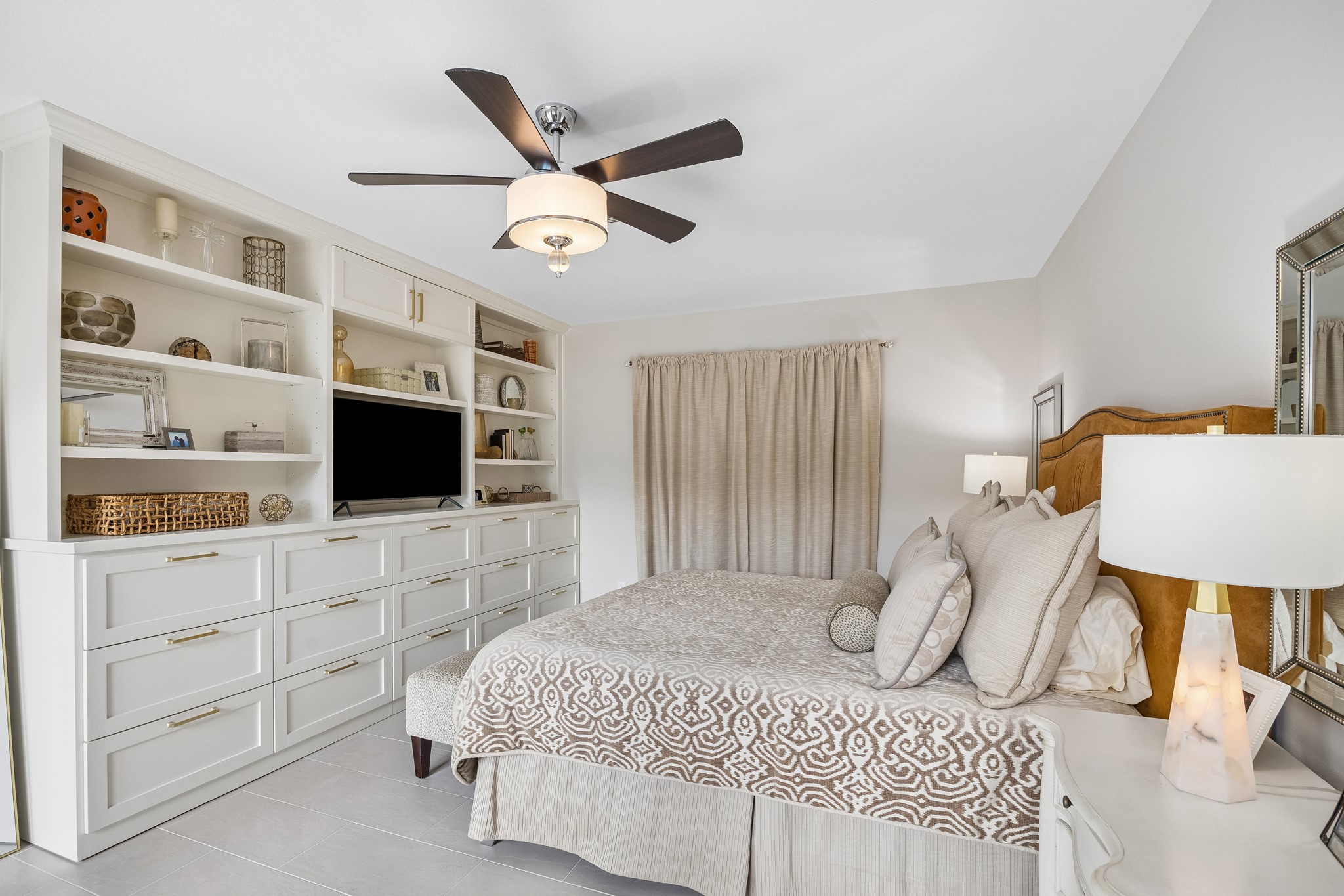 Opposite view of Primary Bedroom showcases the custom built-in cabinetry providing an abundance of storage.