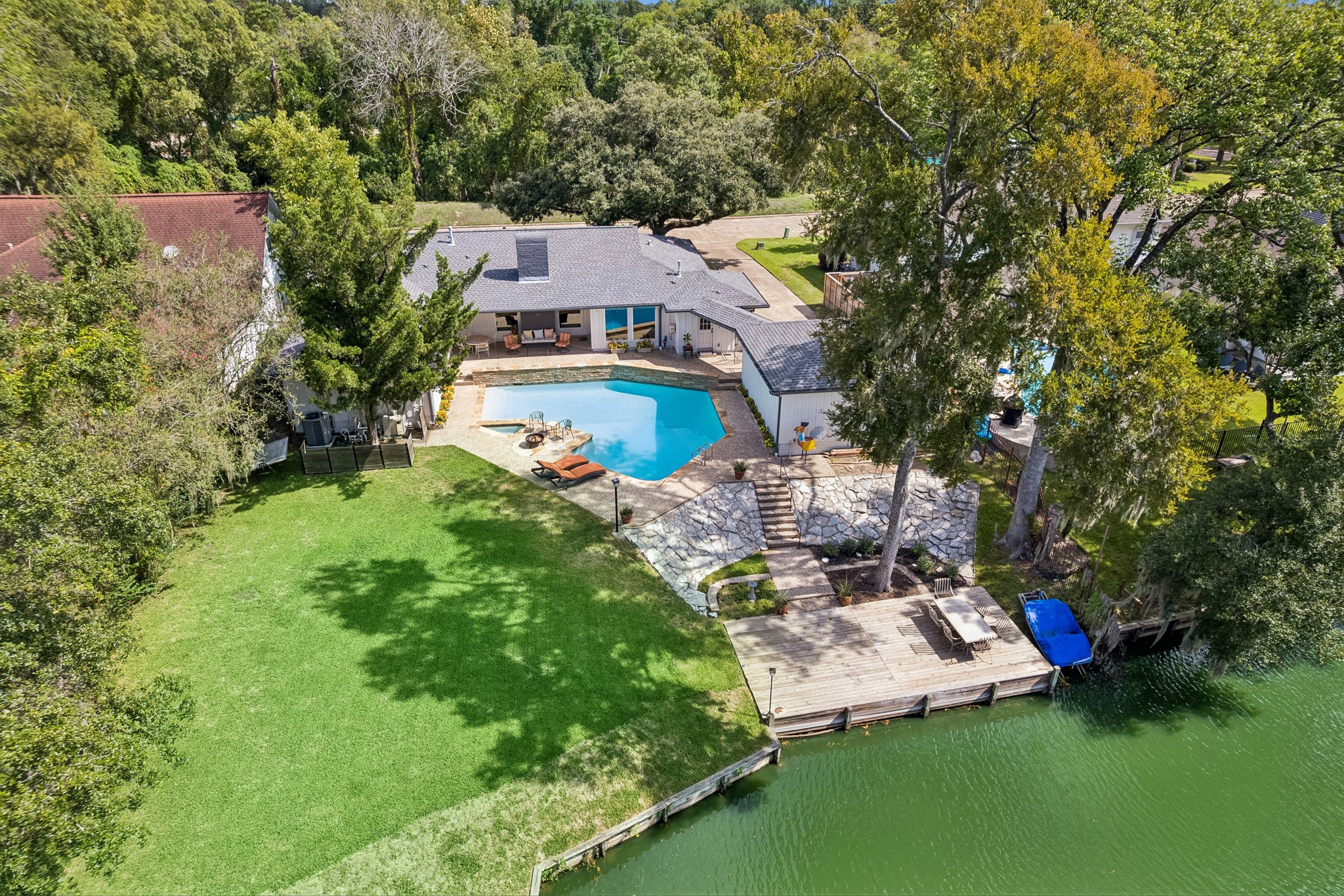 Welcome to 12314 Honeywood Trail! A gorgeous waterfront home with a large pool and a private dock!
