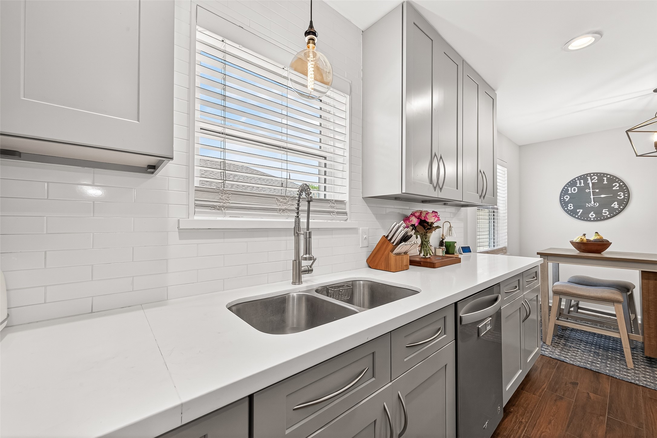 Kitchen with a thoughtfully positioned sink that allows you to wash dishes while enjoying peaceful views of the outdoors, bringing natural light and a relaxing backdrop to daily tasks.
