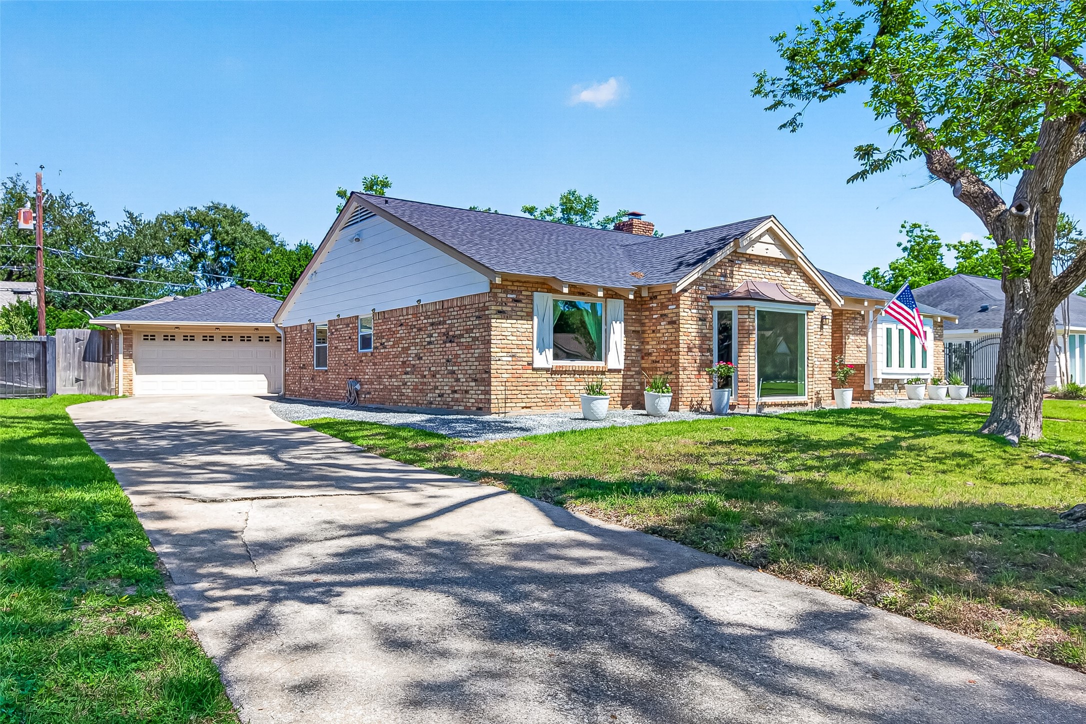 Charming brick home on a beautiful lot with a 2-car detached garage.