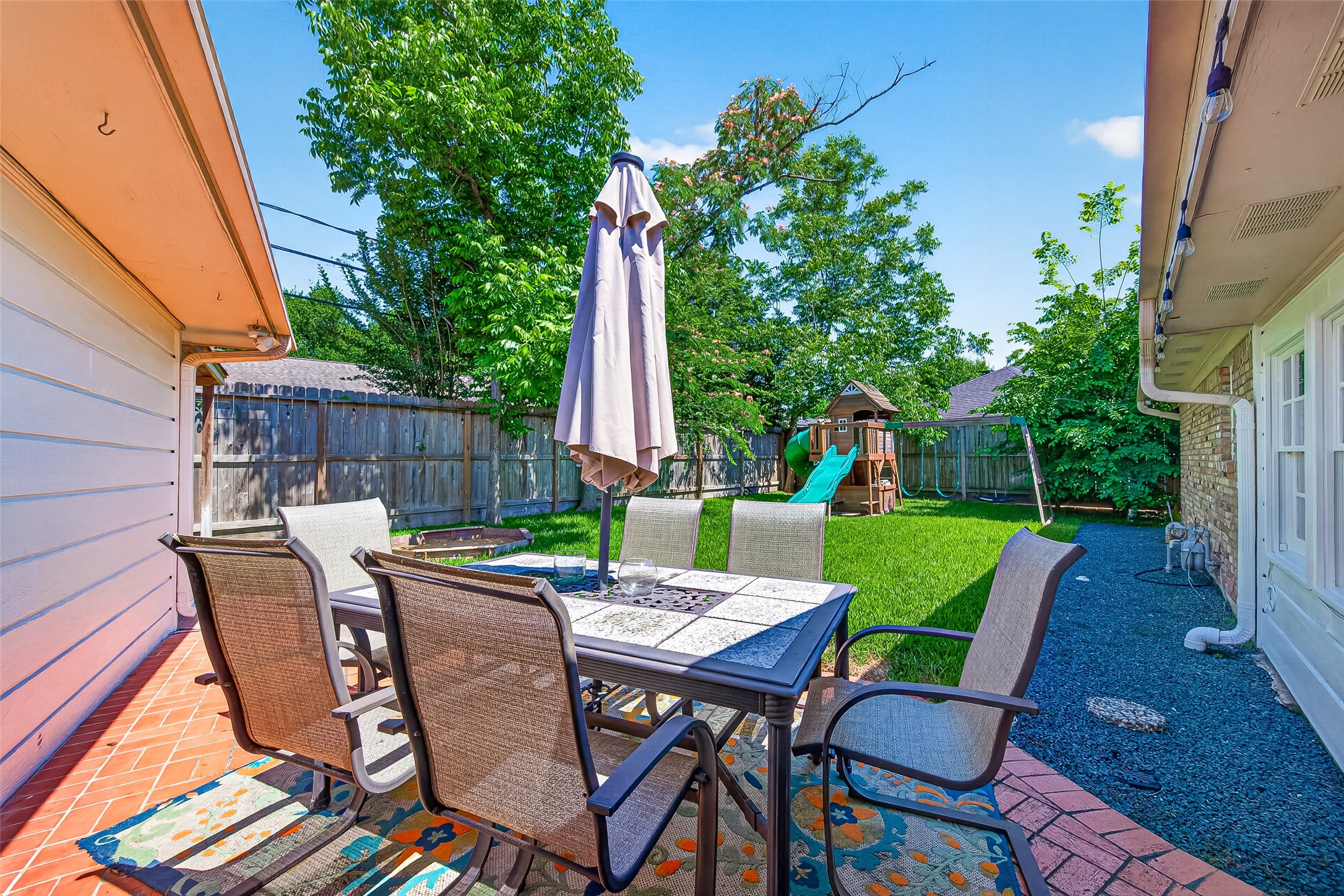 This yard is perfect for family gatherings and relaxation.