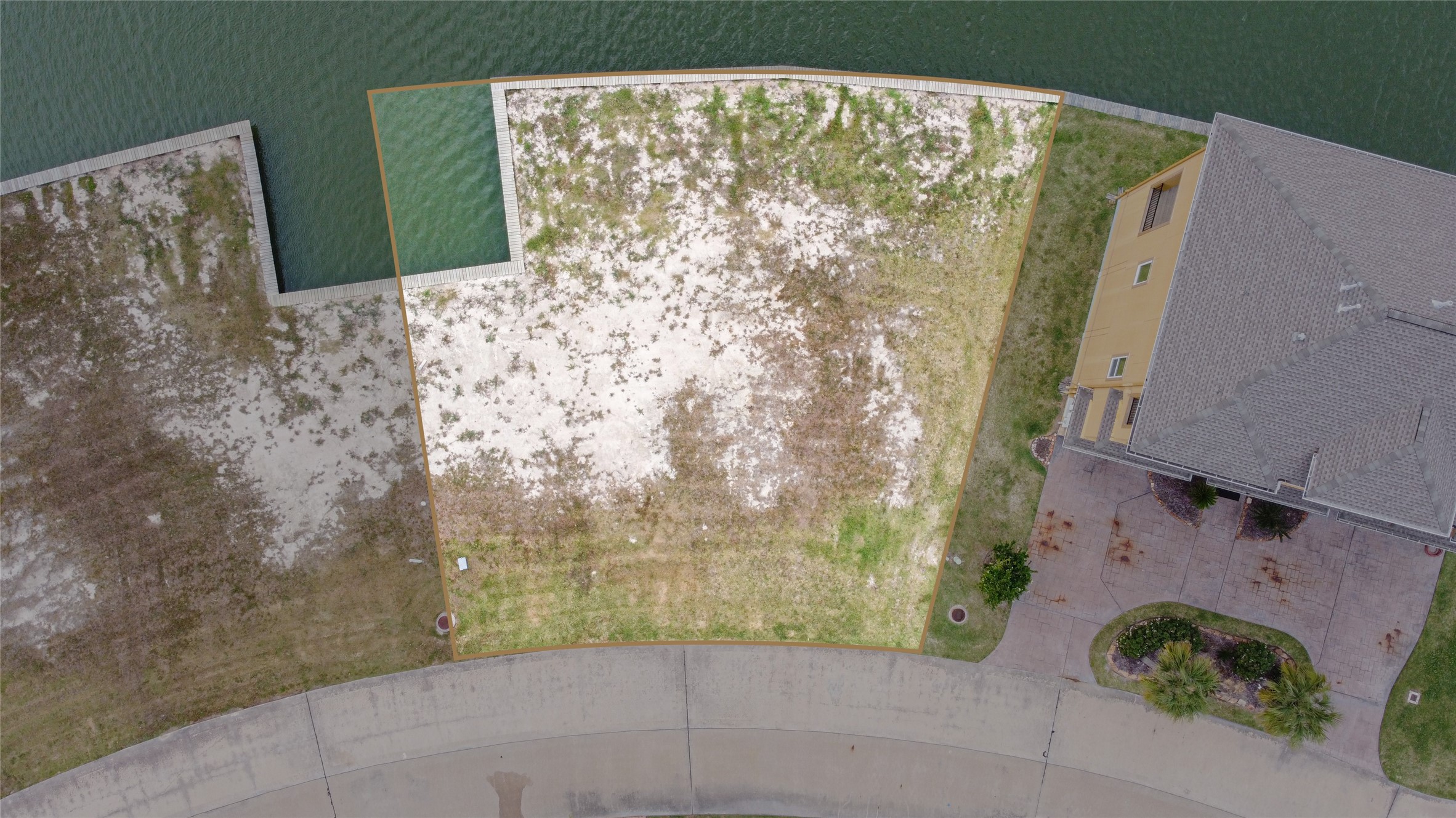 An overview with estimated property lines. The bulkhead is maintained by the MUD.