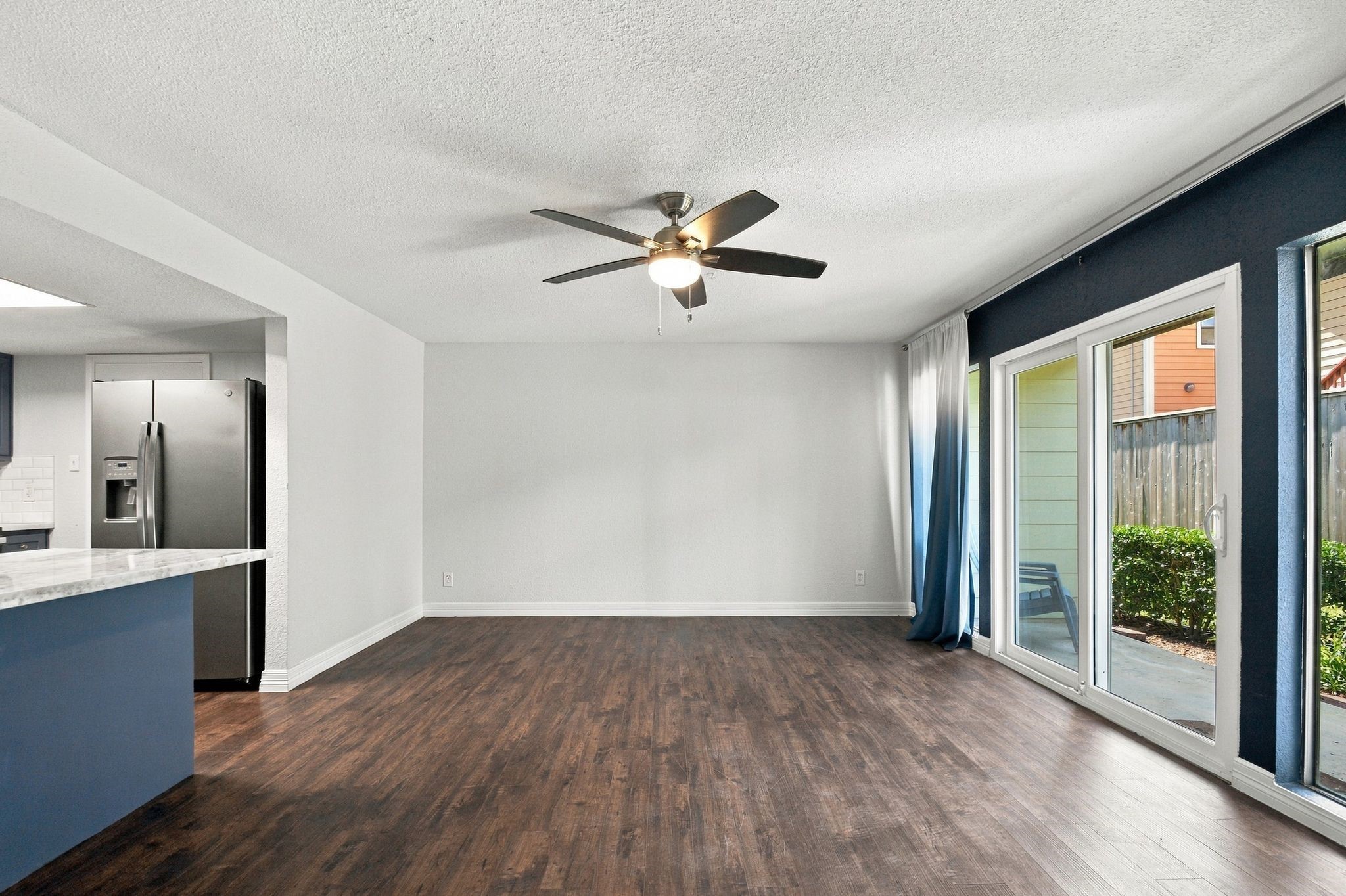 The Living Room is very spacious and is open to the Kitchen - great for entertaining or just relaxing and enjoying your upgraded features. The Living Room is very spacious and is open to the Kitchen - great for entertaining or just relaxing and enjoying your upgraded features.