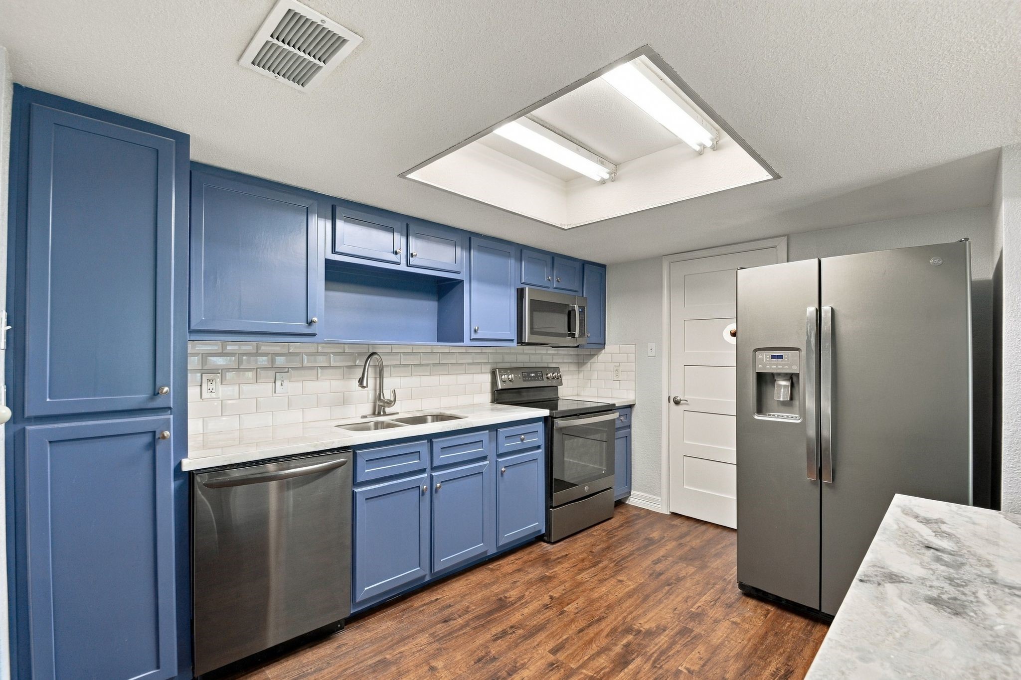 Lots of extra storage with the extra built in pantry next to the dishwasher and center island storage that was added. There is also a walk in Pantry across from the utility area closet off of the Kitchen. Lots of extra storage with the extra built in pantry next to the dishwasher and center island storage that was added. There is also a walk in Pantry across from the utility area closet off of the Kitchen.